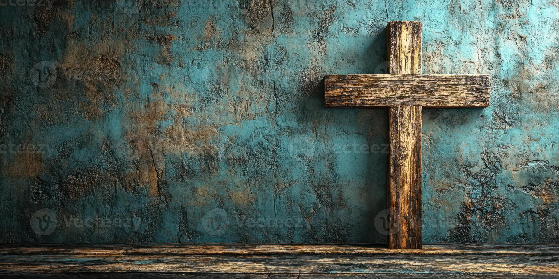 Wooden cross stands against a textured blue wall in a quiet interior space photo