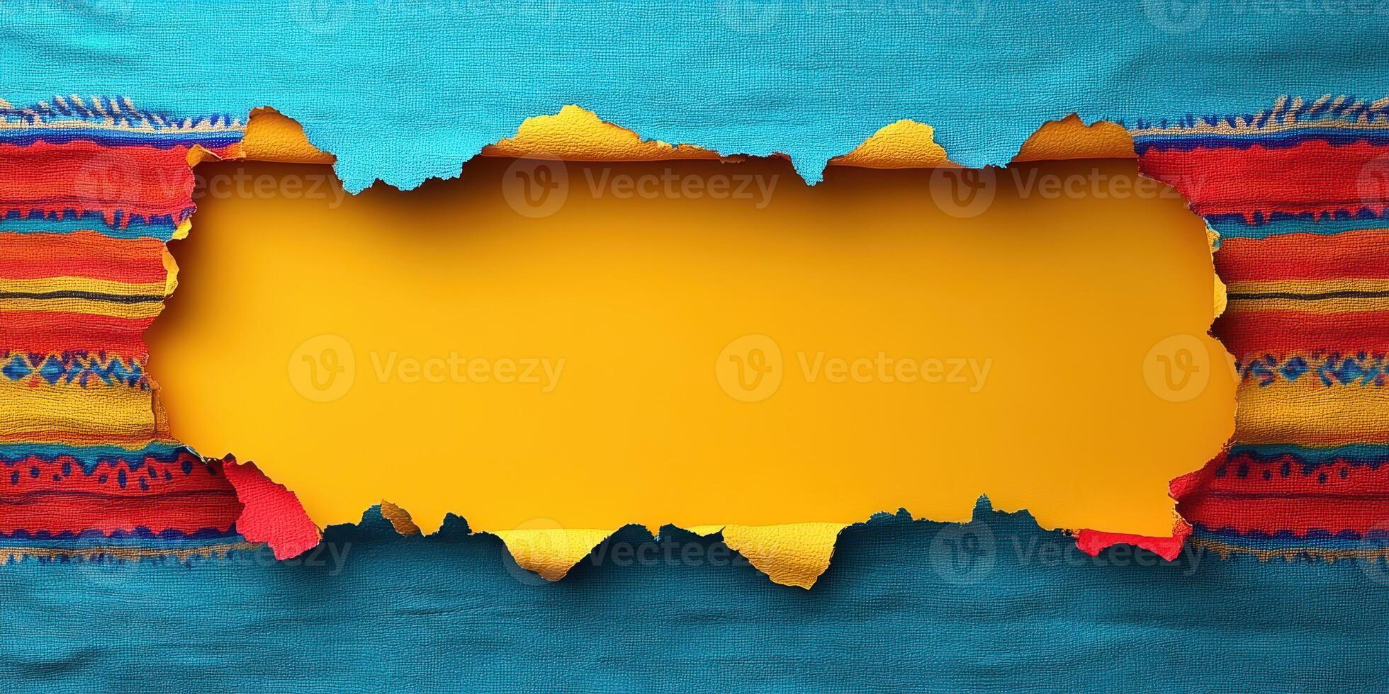 Colorful textile background with torn paper revealing a vibrant yellow space for text photo