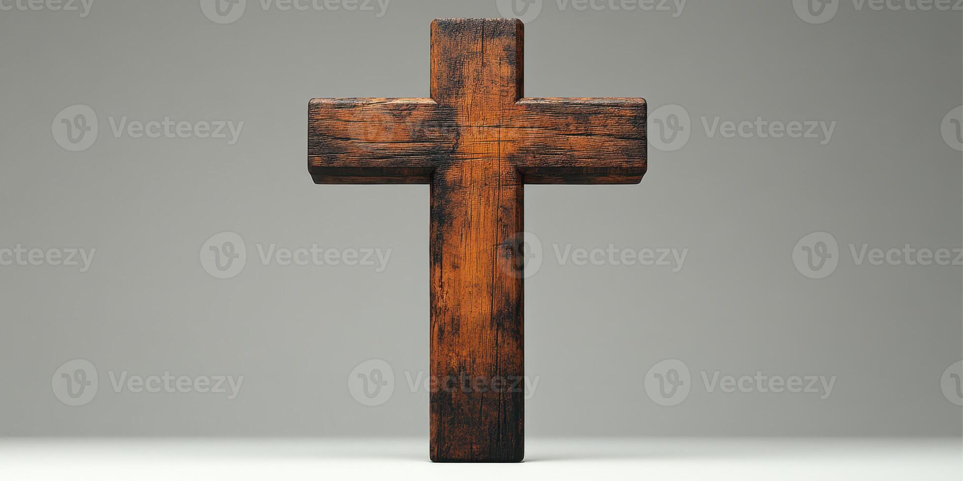Wooden cross on a flat surface with a plain background highlighting its texture and craftsmanship photo