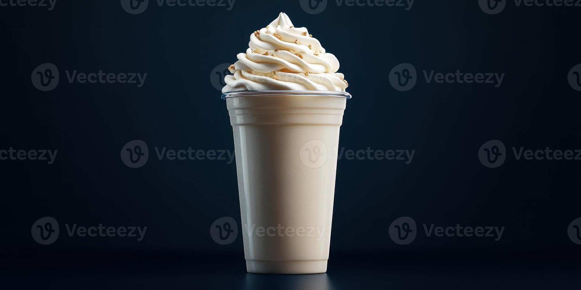 Delicious creamy dessert topped with rich whipped cream in a cup served against a dark background photo