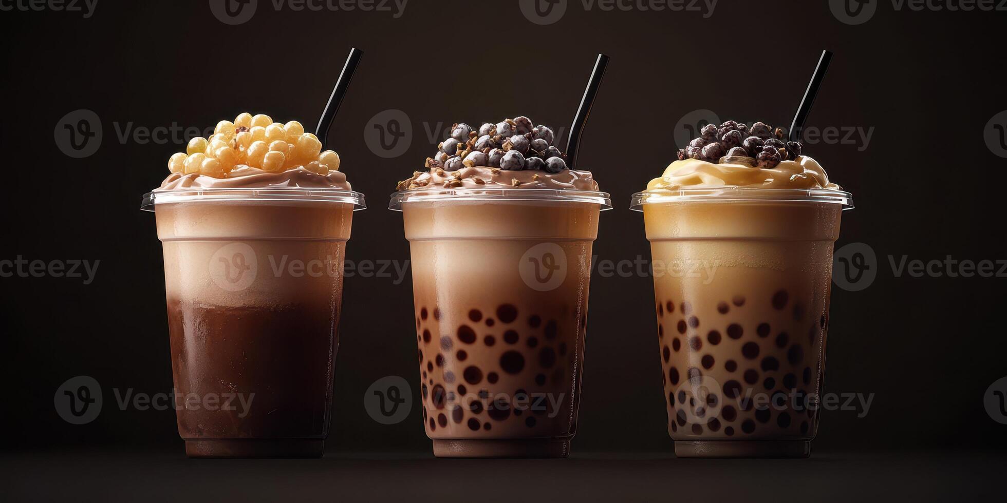 Delicious bubble tea drinks with creamy toppings served in clear cups on a dark background photo