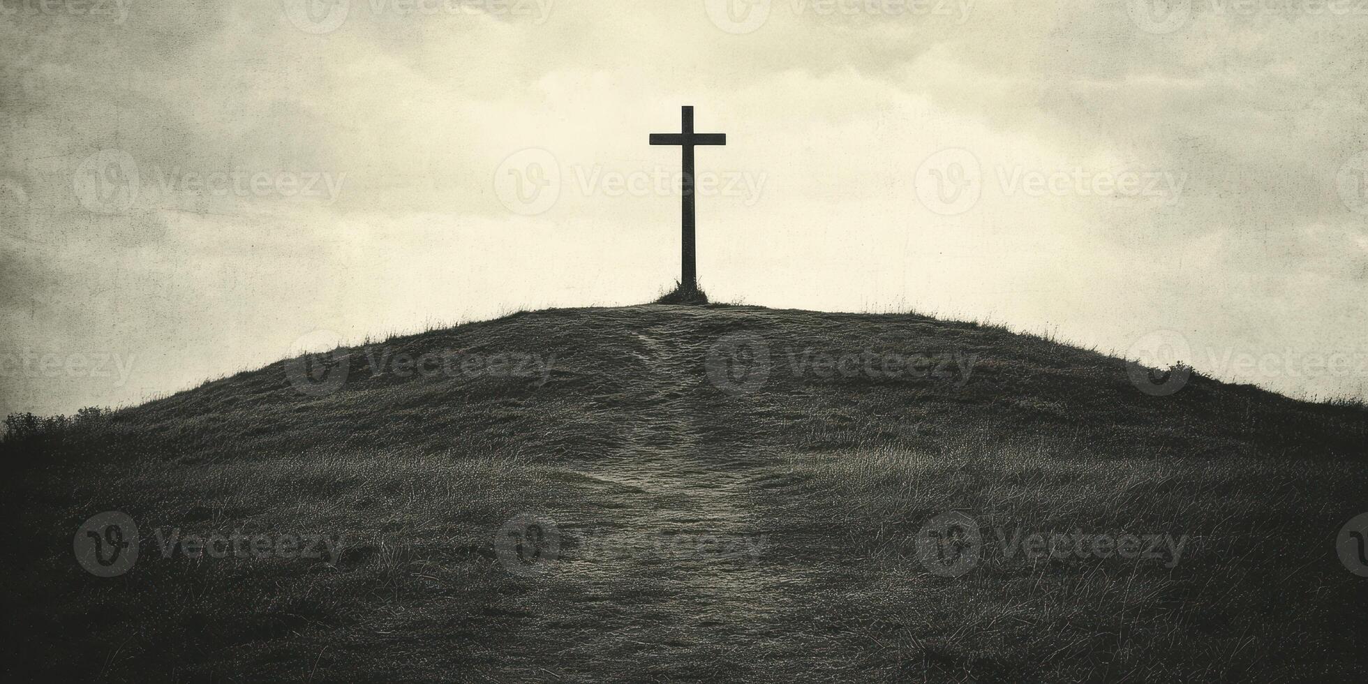 Cross atop a hill under an overcast sky at dusk with a winding path leading up to it photo