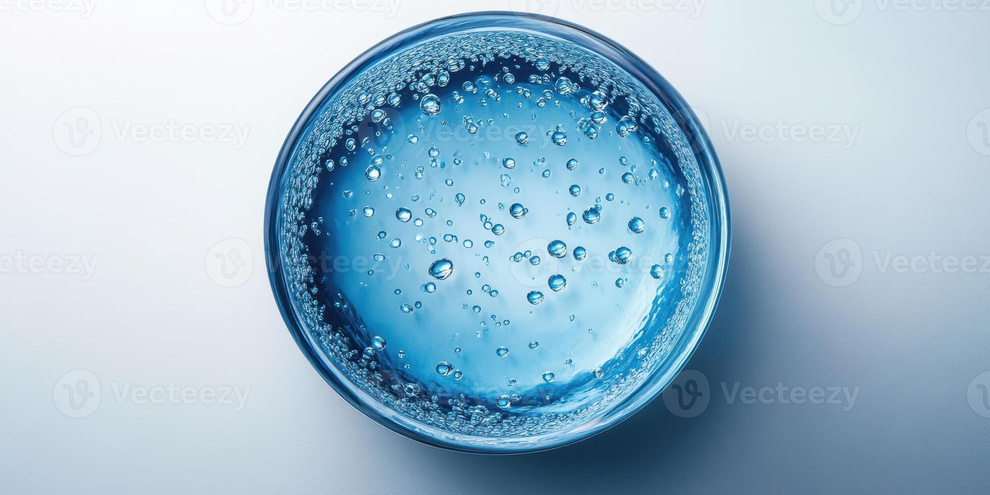 Clear water with bubbles in a glass container illuminated under soft light in a tranquil setting photo