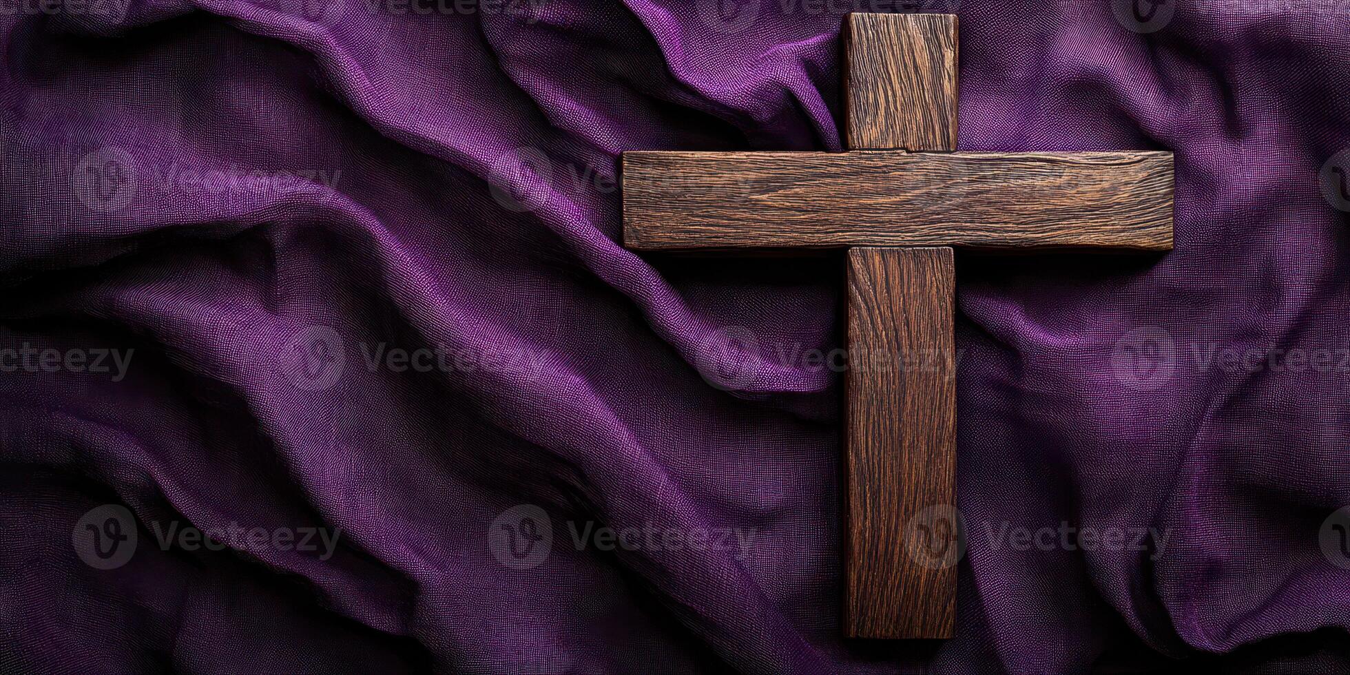 Wooden cross placed on textured purple fabric, symbolizing faith and spirituality during a solemn occasion photo