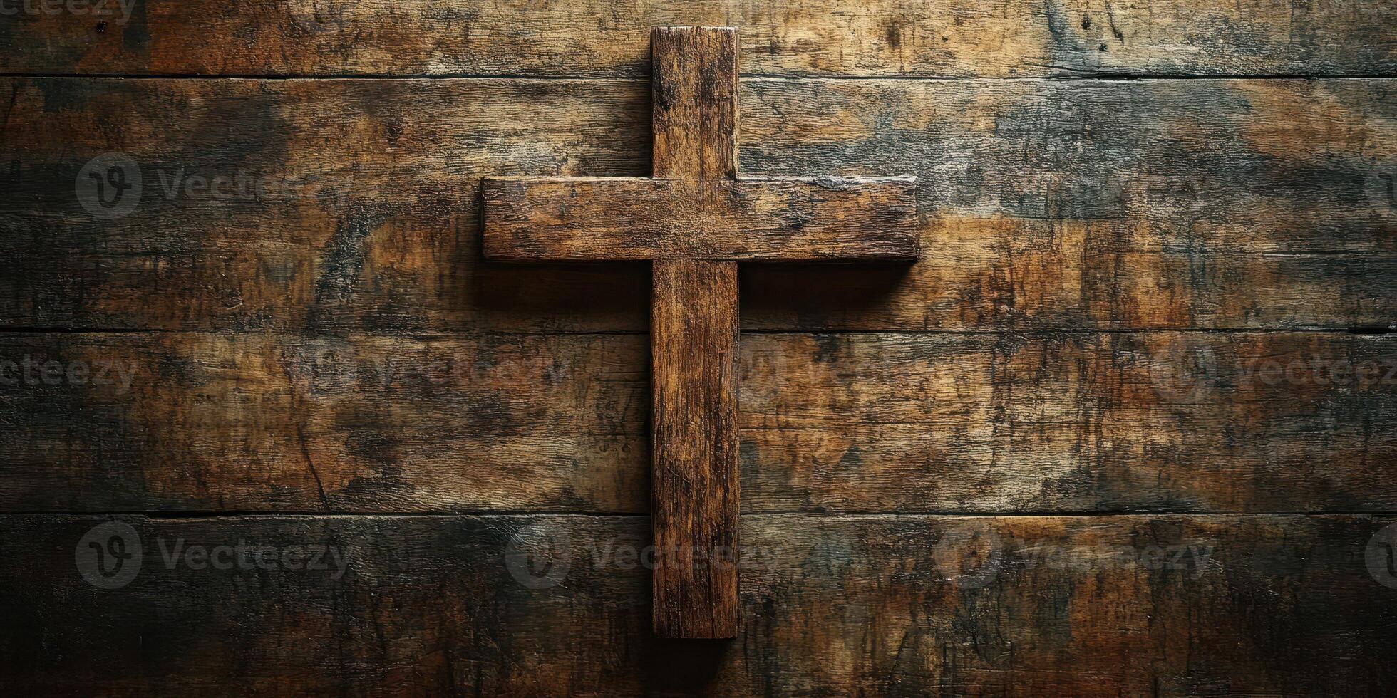 Rustic wooden cross mounted on weathered barn wood background creates a serene and spiritual atmosphere photo