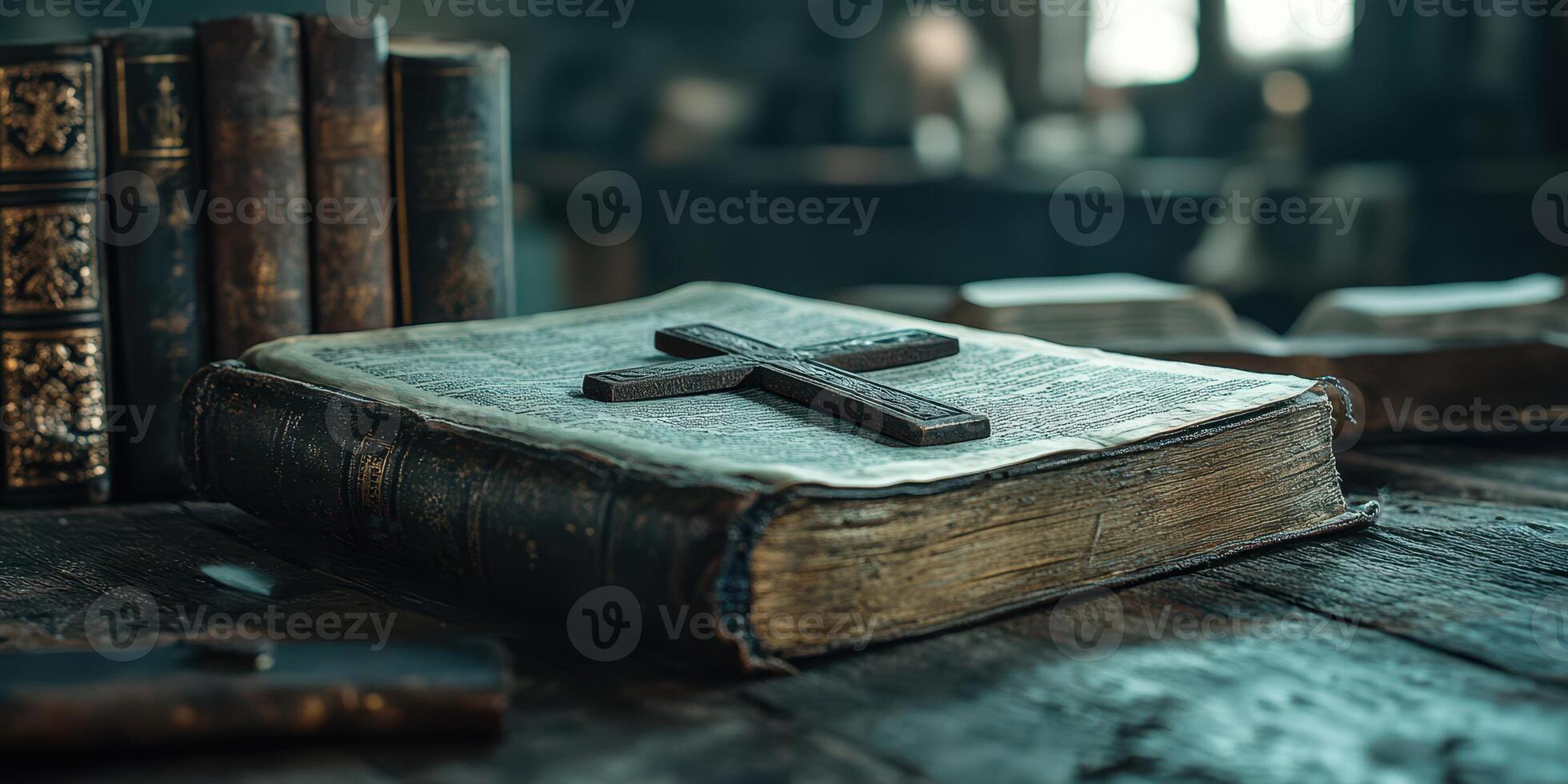 Antique book with a wooden cross placed on top in a rustic library setting photo