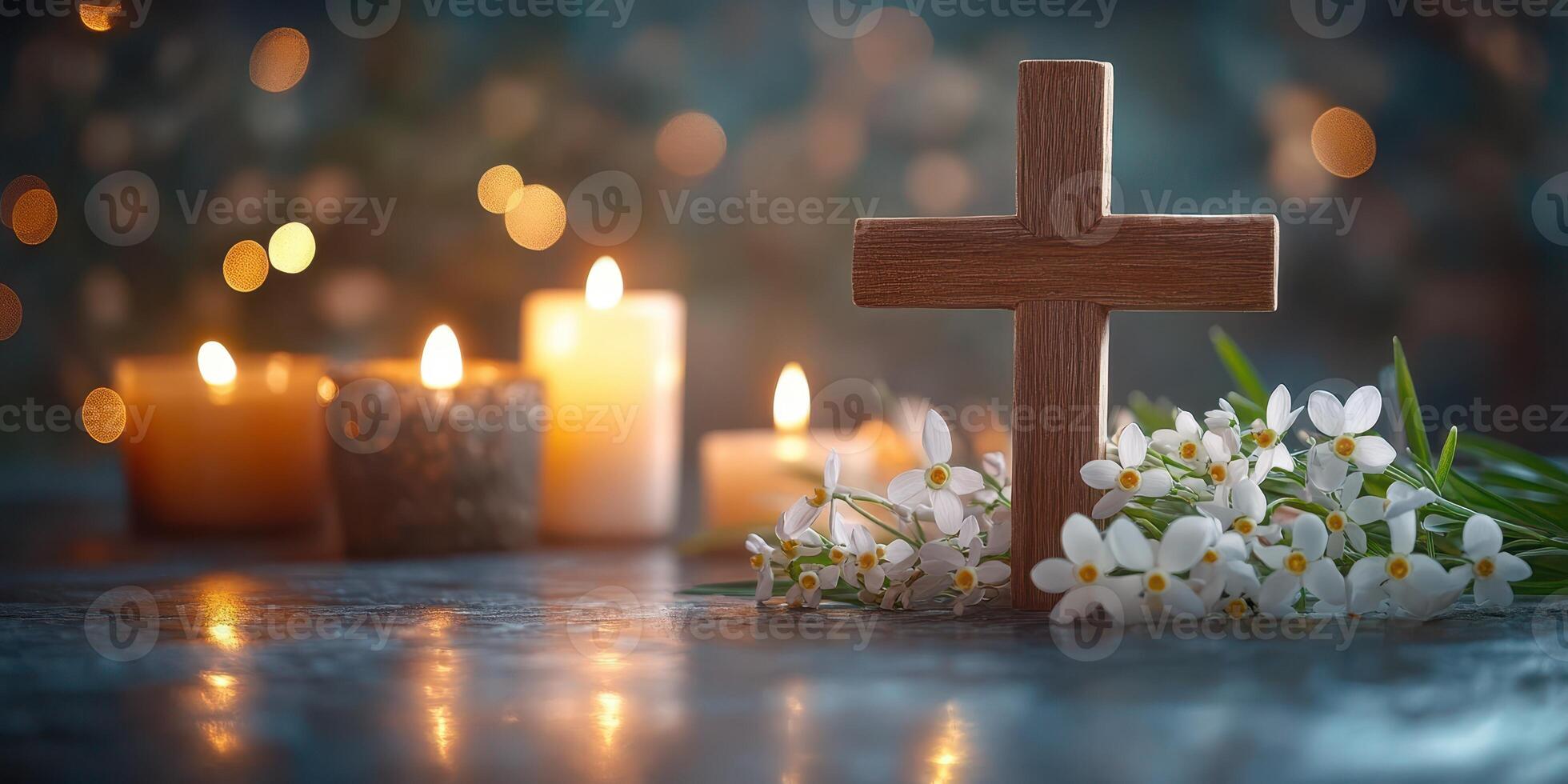 Wooden cross with white flowers and illuminated candles creating a serene atmosphere for reflection and prayer photo