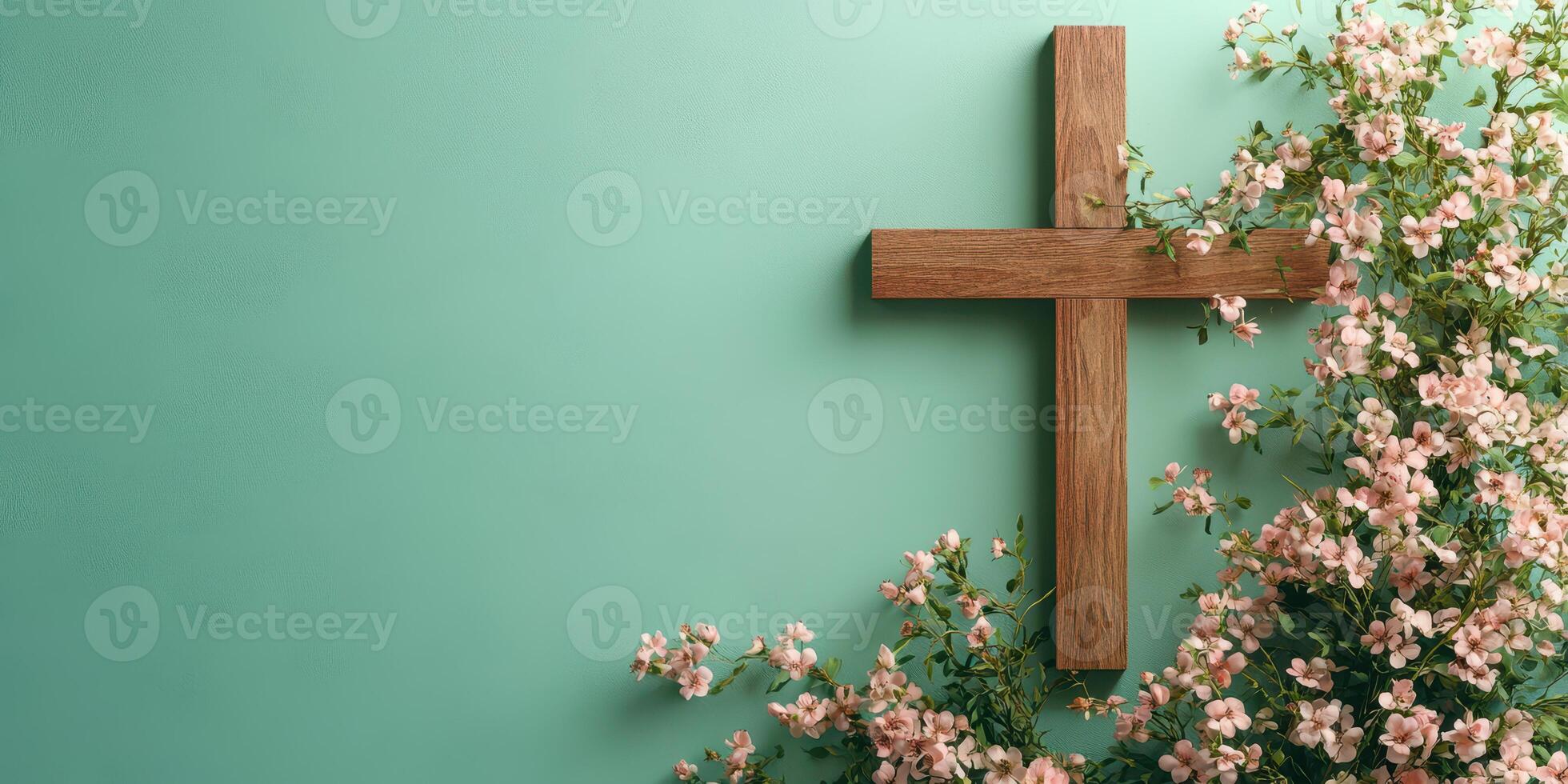Wooden cross adorned with delicate flowers against a teal wall, showcasing a serene and contemplative atmosphere photo