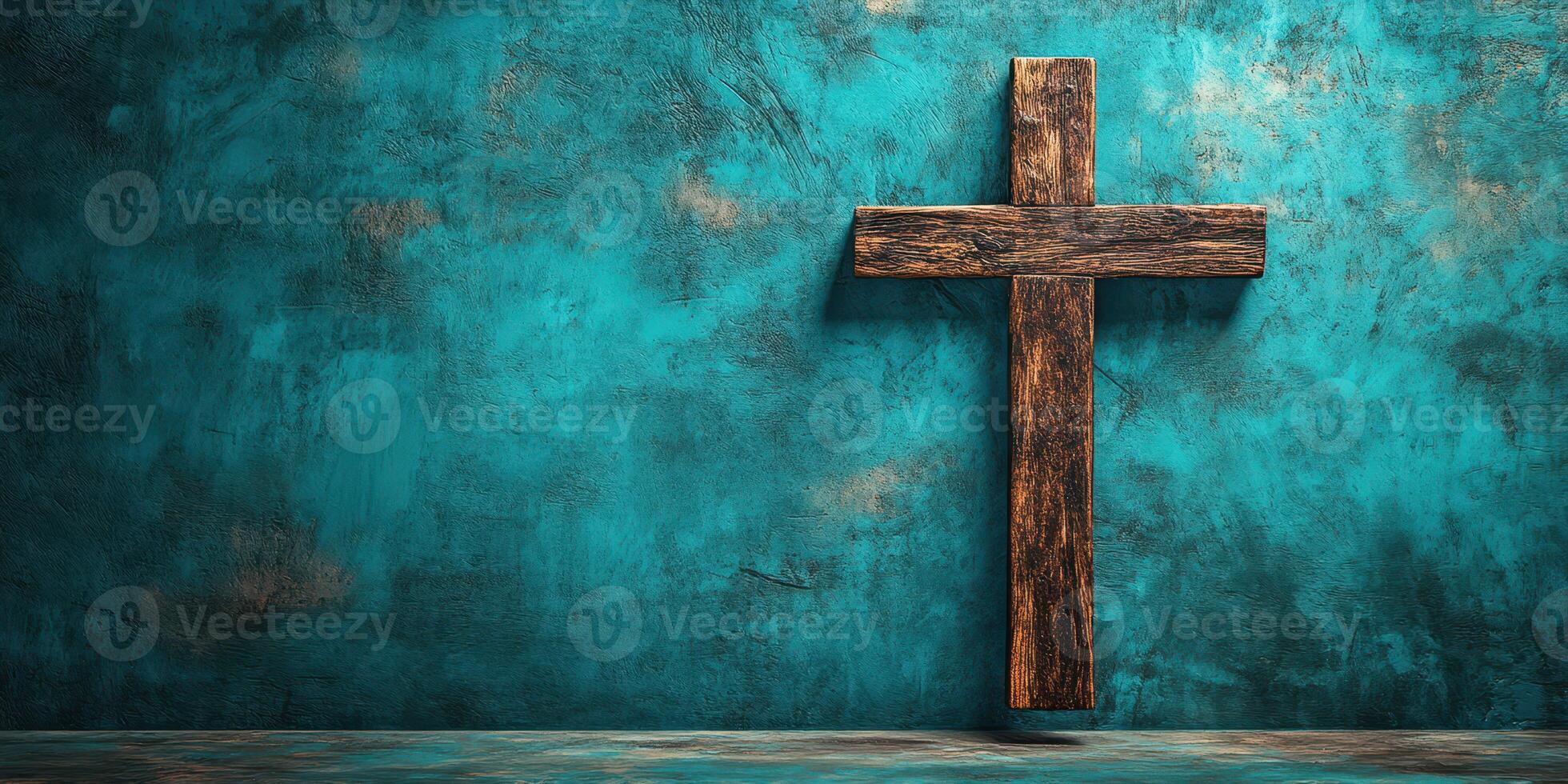 Wooden cross against a textured turquoise wall in a serene setting for reflection and meditation photo