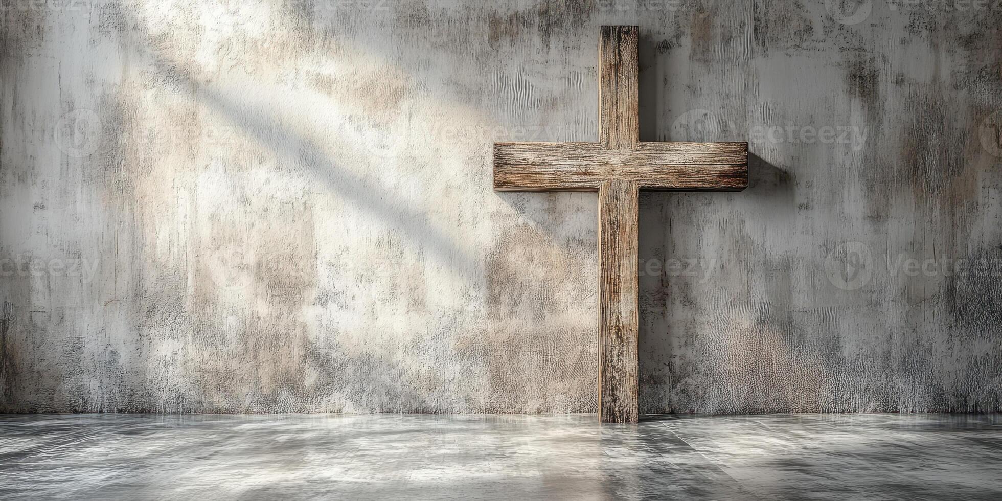 Wooden cross stands against a weathered concrete wall in a serene, softly lit space photo