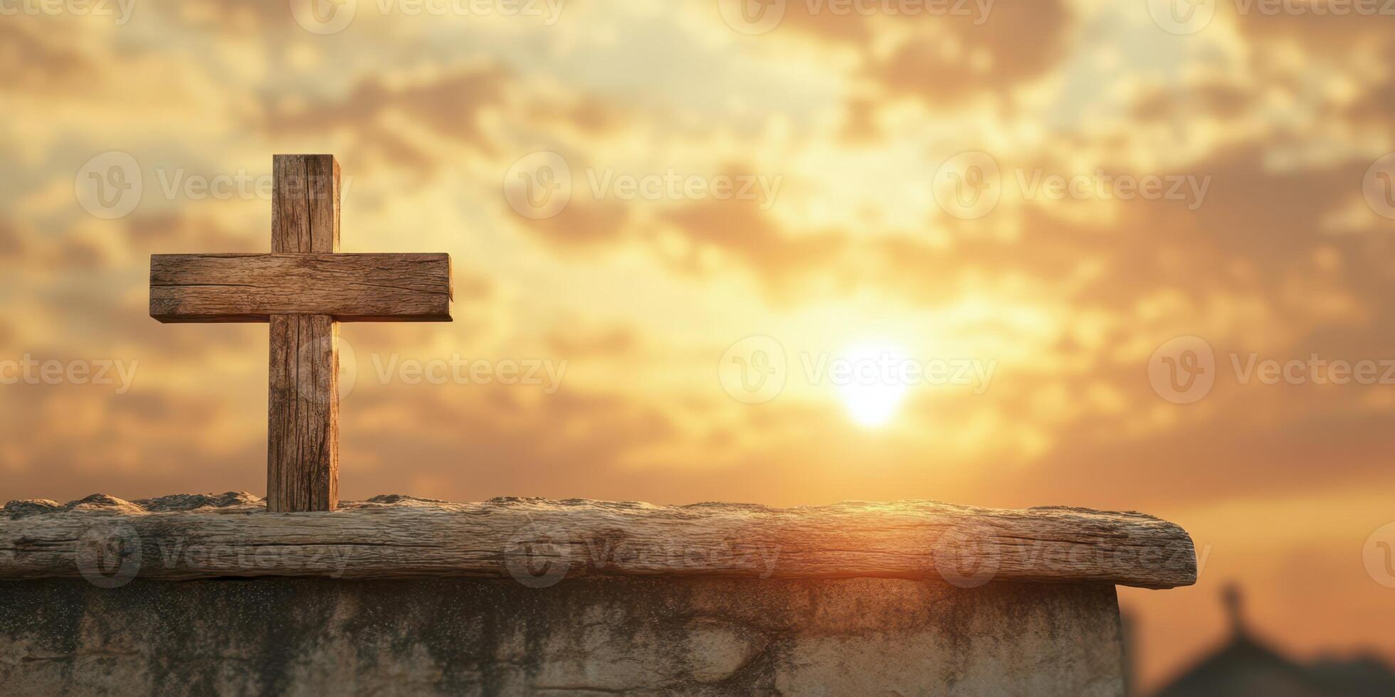 Sunset view with wooden cross on stone wall against cloudy sky photo