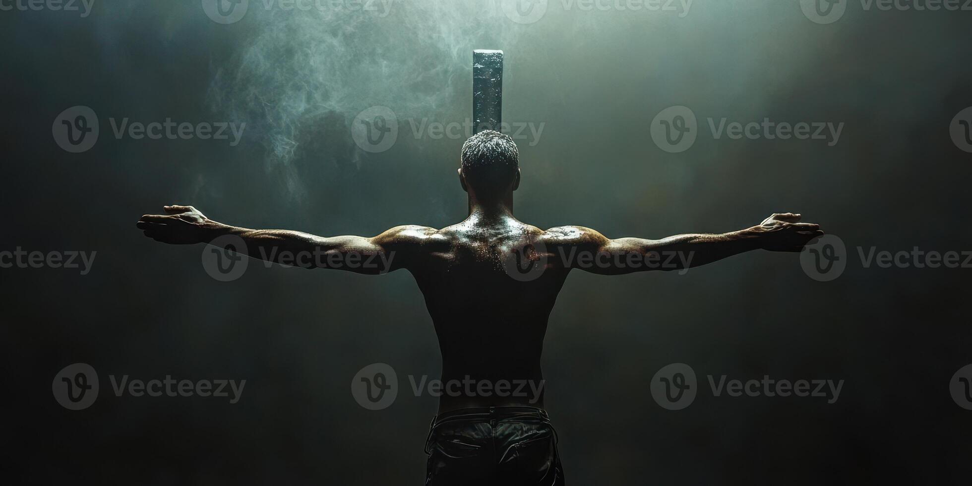 Powerful figure with outstretched arms stands before a large metallic block in a dramatic, dimly lit environment photo