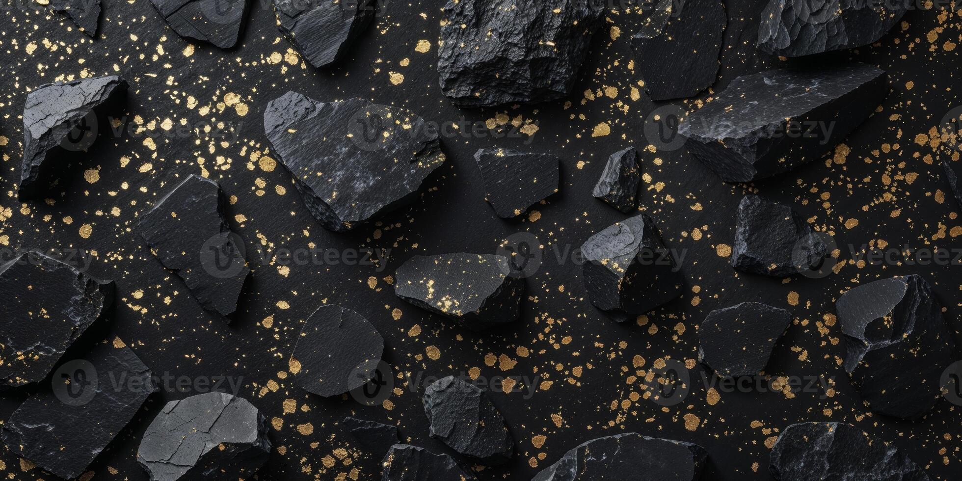 Crushed black stone background with gold flecks for dark textures photo