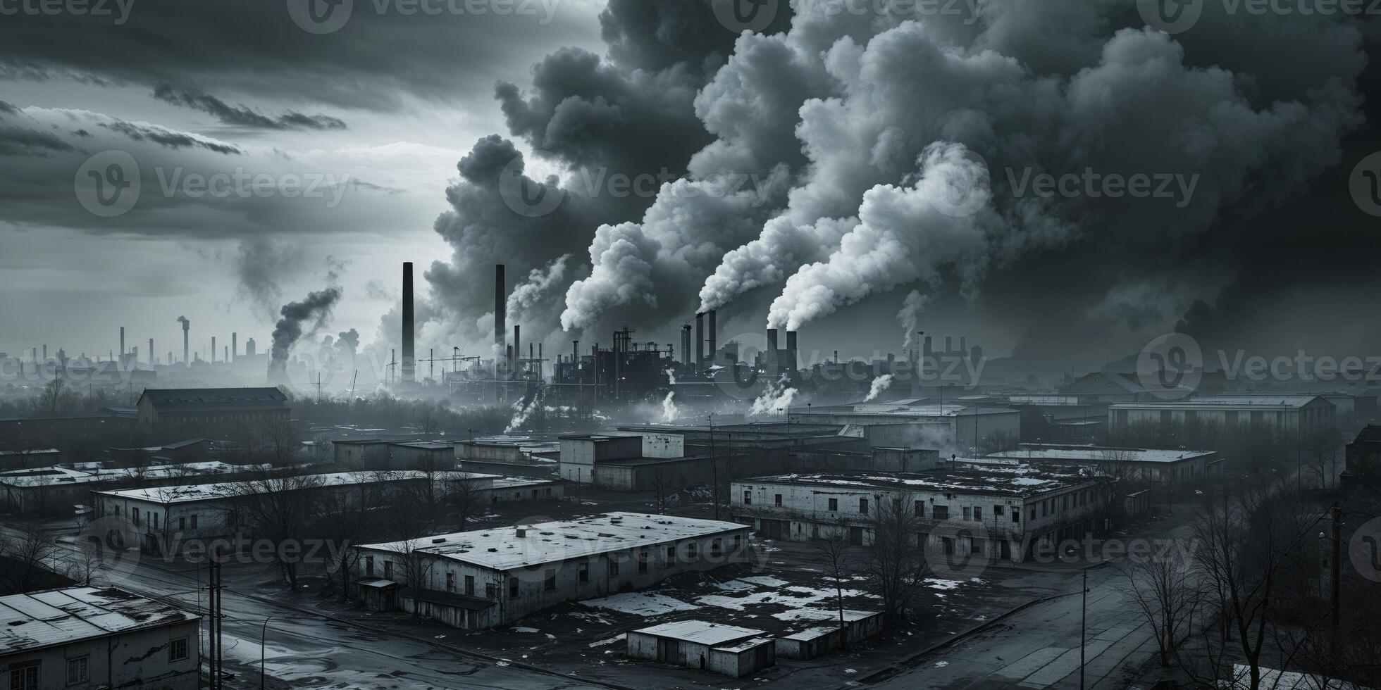 A black and white photo of a factory with smoke coming out of it