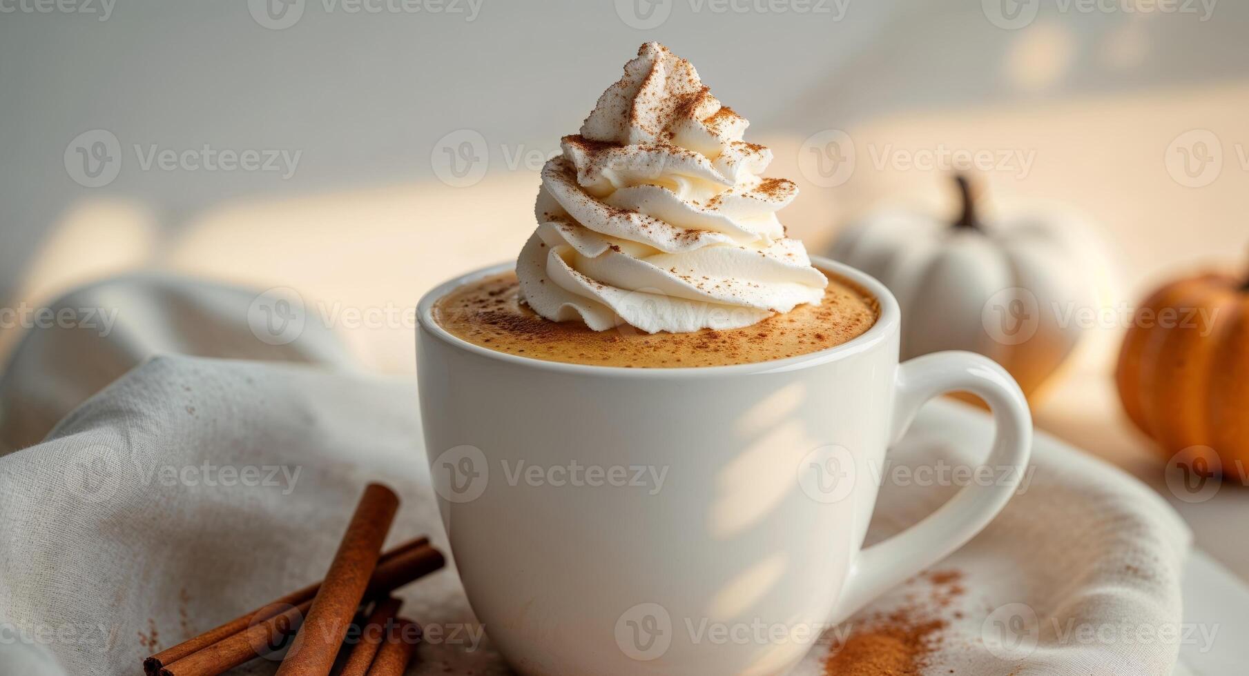 Pumpkin spice latte with whipped cream and cinnamon in a cup. photo
