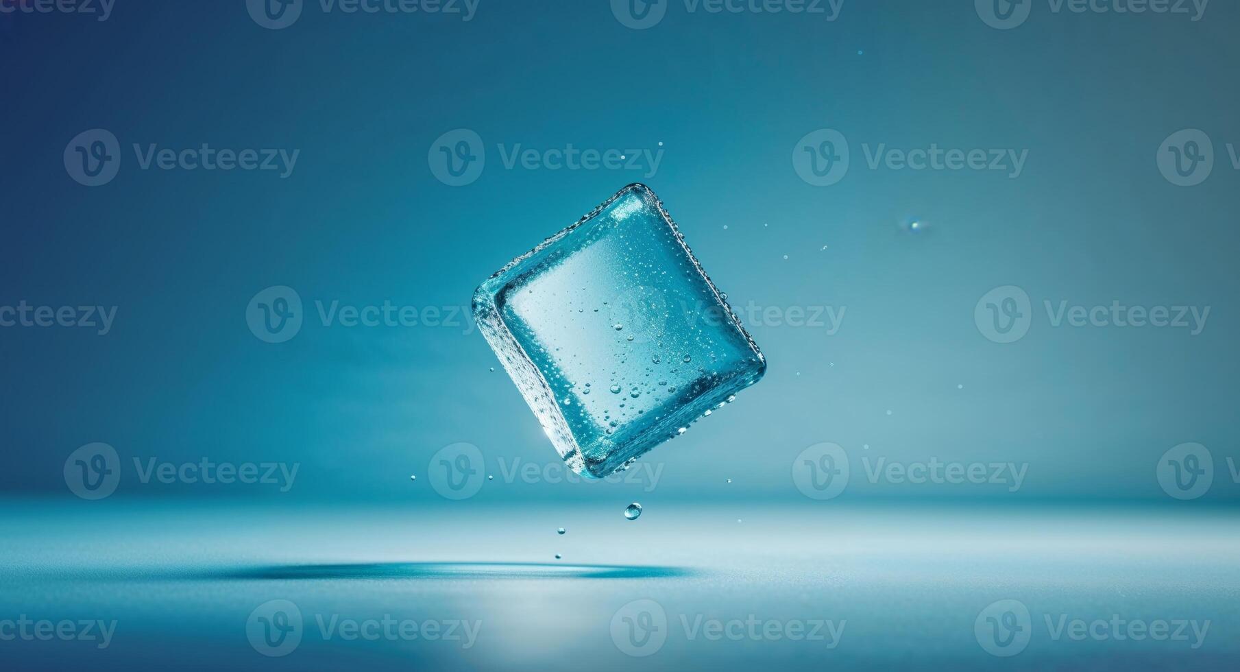 A square of ice falling into water photo