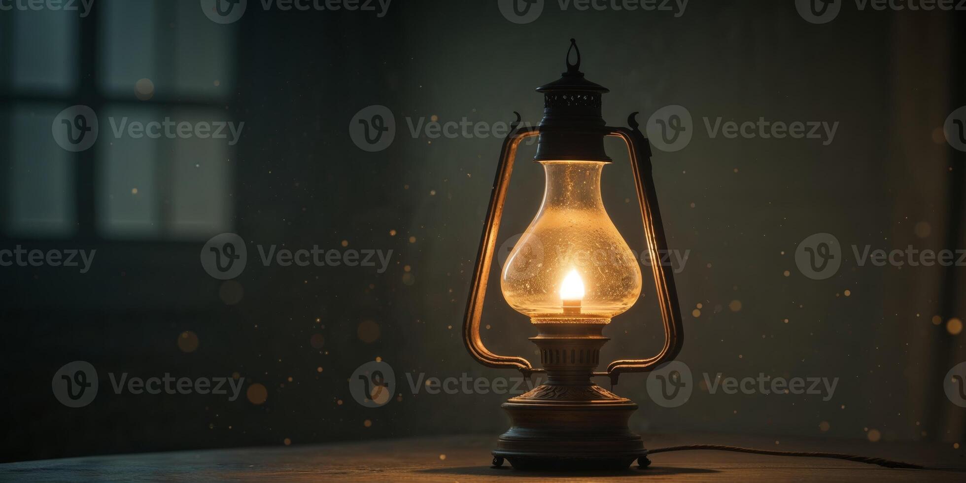 An old fashioned lamp is lit up in the dark photo