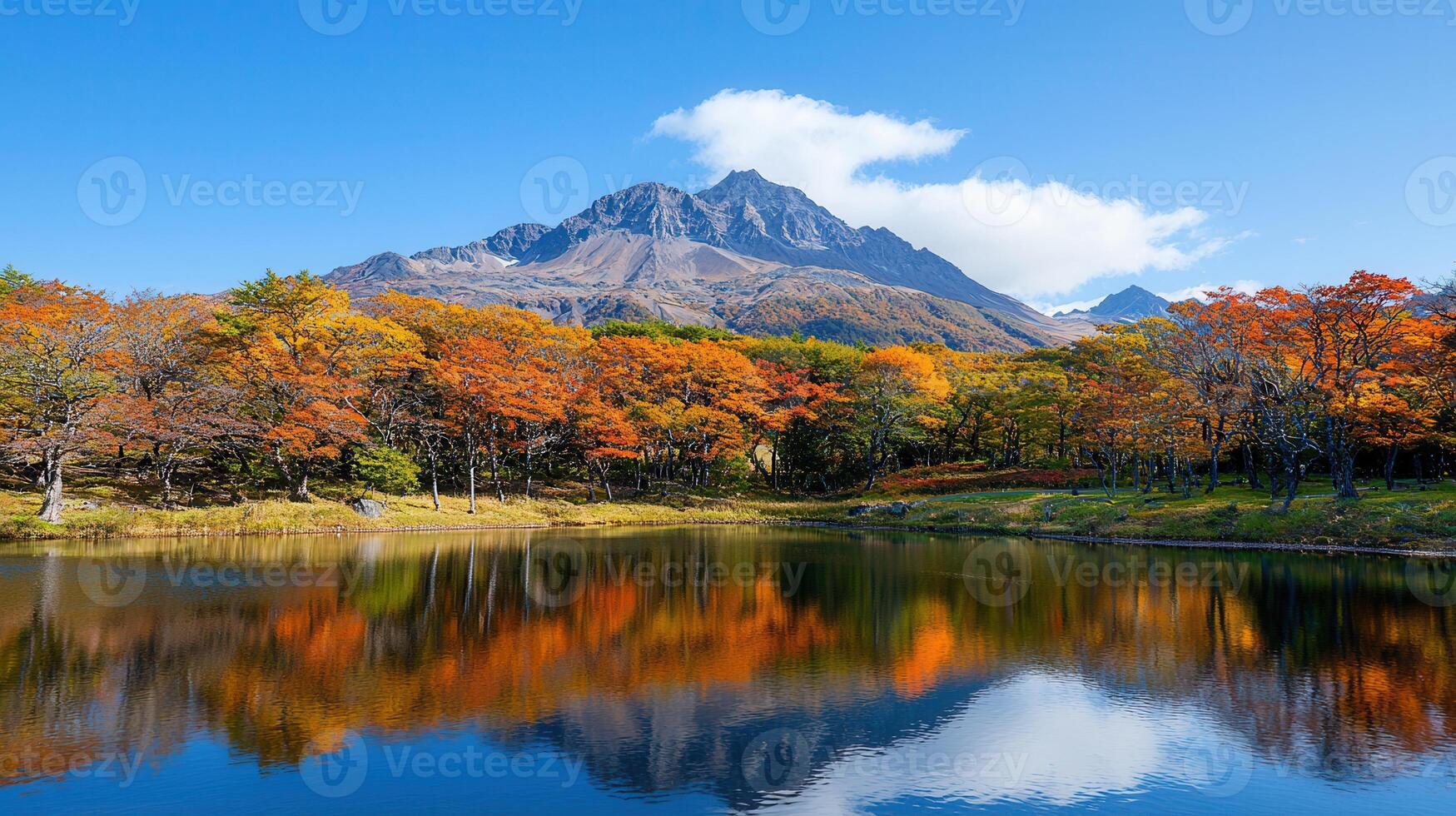 Stunning Autumnal Landscape Mountain Lake Reflected in Colorful Fall Foliage photo