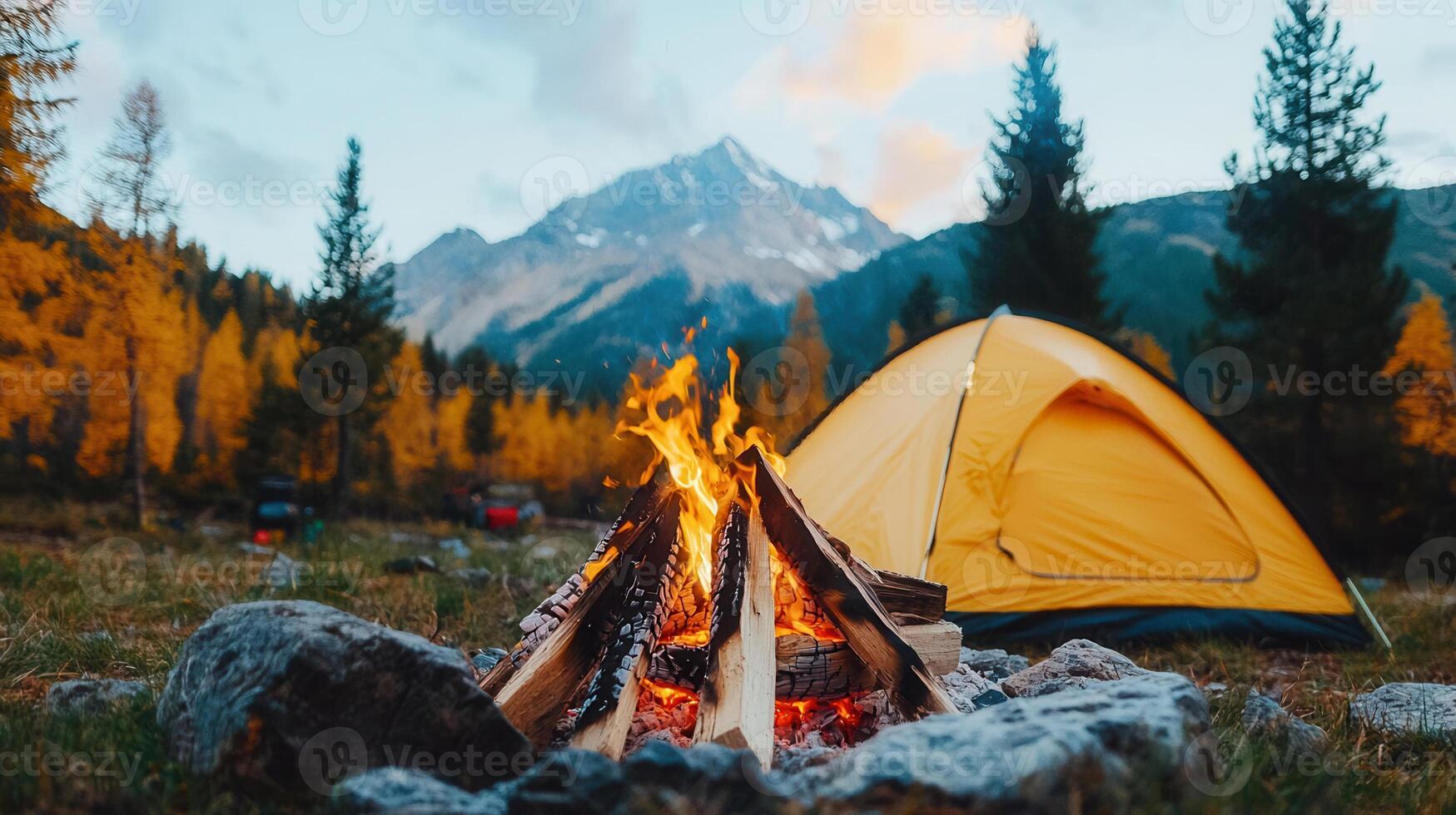 Campfire in Mountains Autumn Scenery Yellow Tent Burning Wood Hiking Trip photo