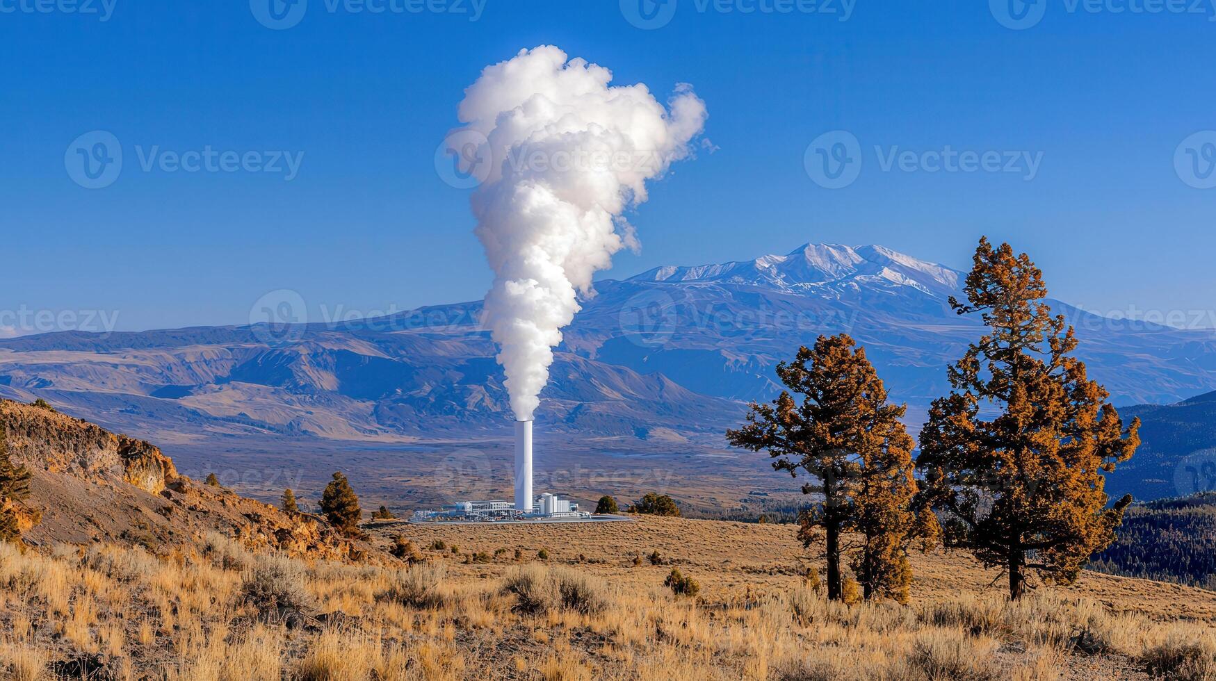 Geothermal Power Plant Steam Plume against Mountain Range Landscape photo