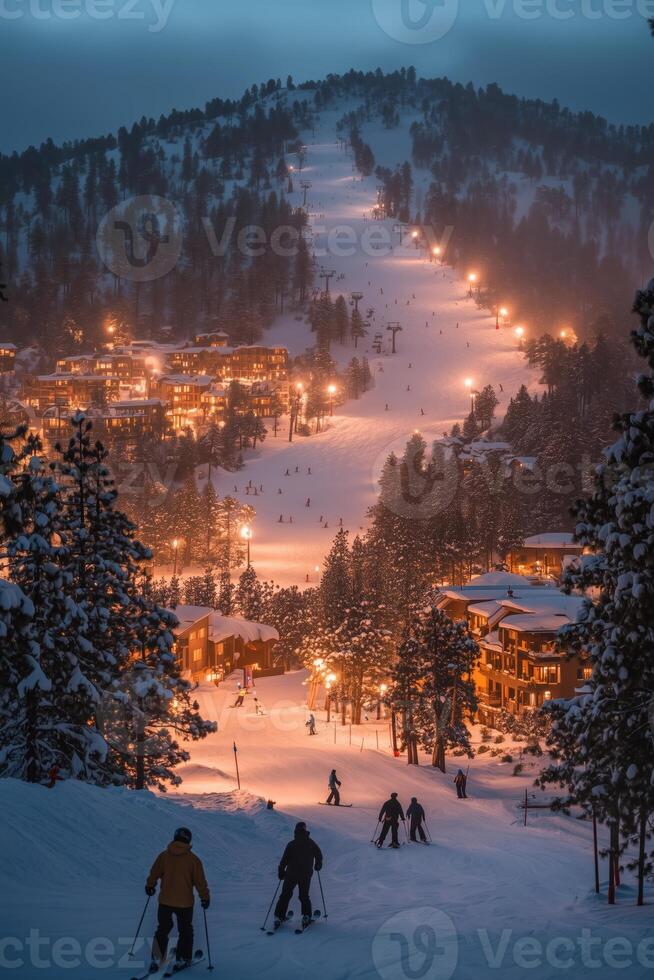Skiers descending a snowy hill with warm lights in a winter resort landscape photo