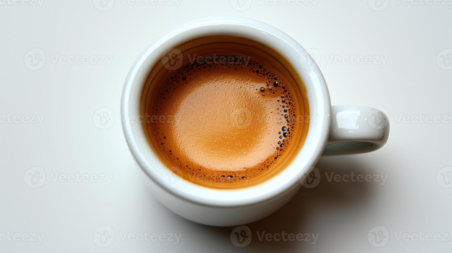 Close-up of a cup of espresso coffee with crema on white background photo