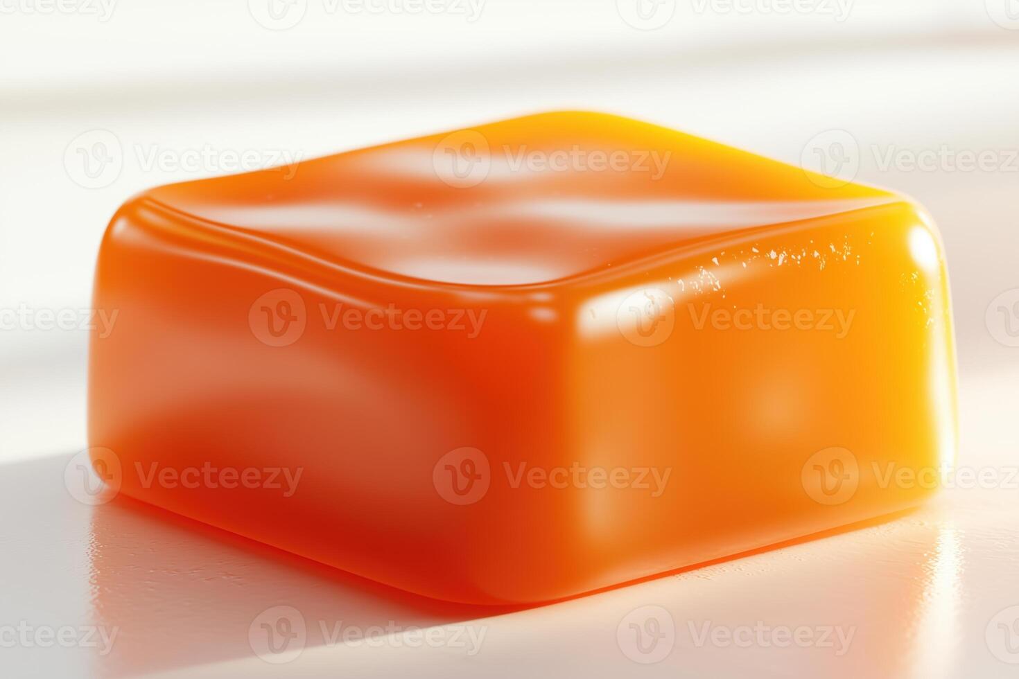 Close-up of an orange soap bar on a white surface photo
