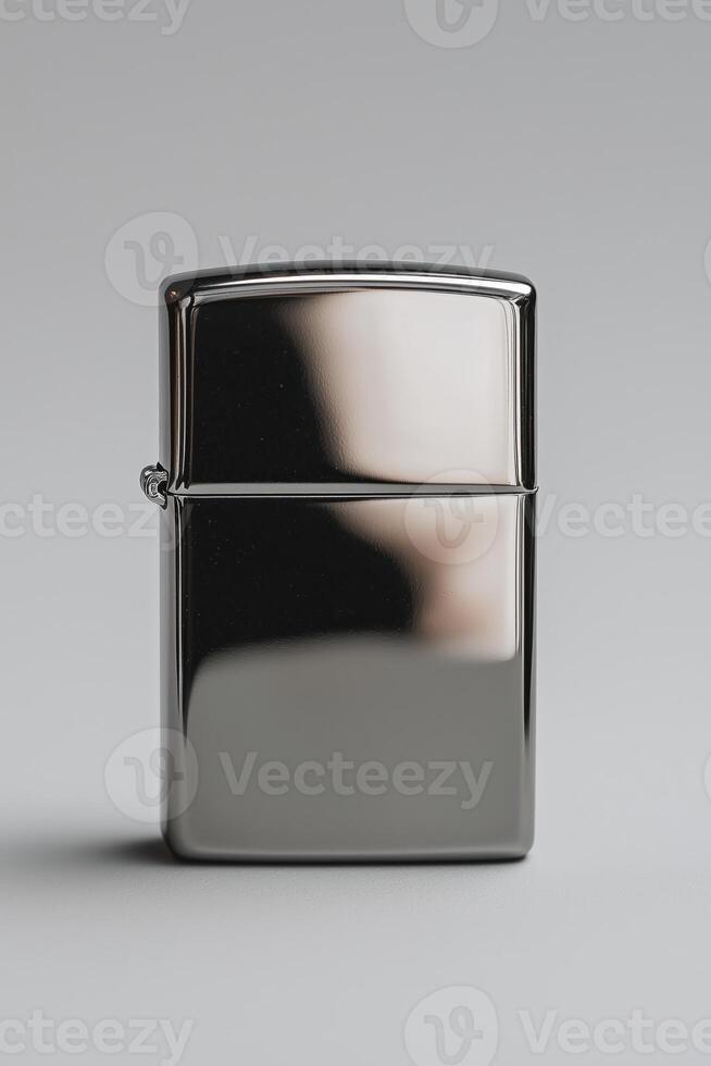 Sleek silver zippo lighter on grey background photo