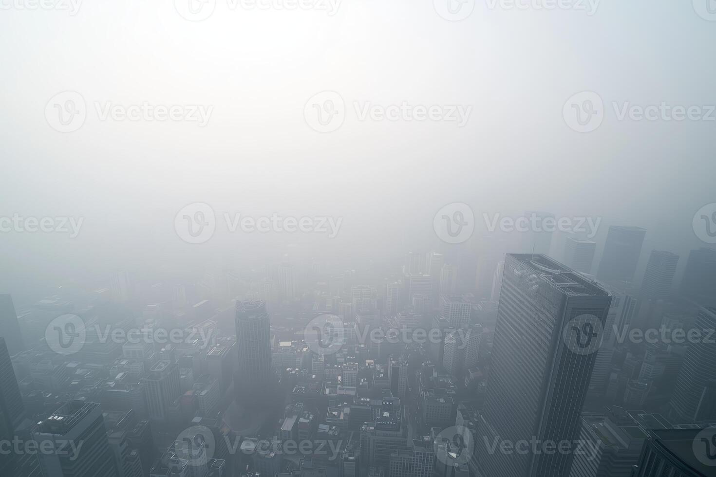 Foggy cityscape view over dense skyscrapers in urban environment photo