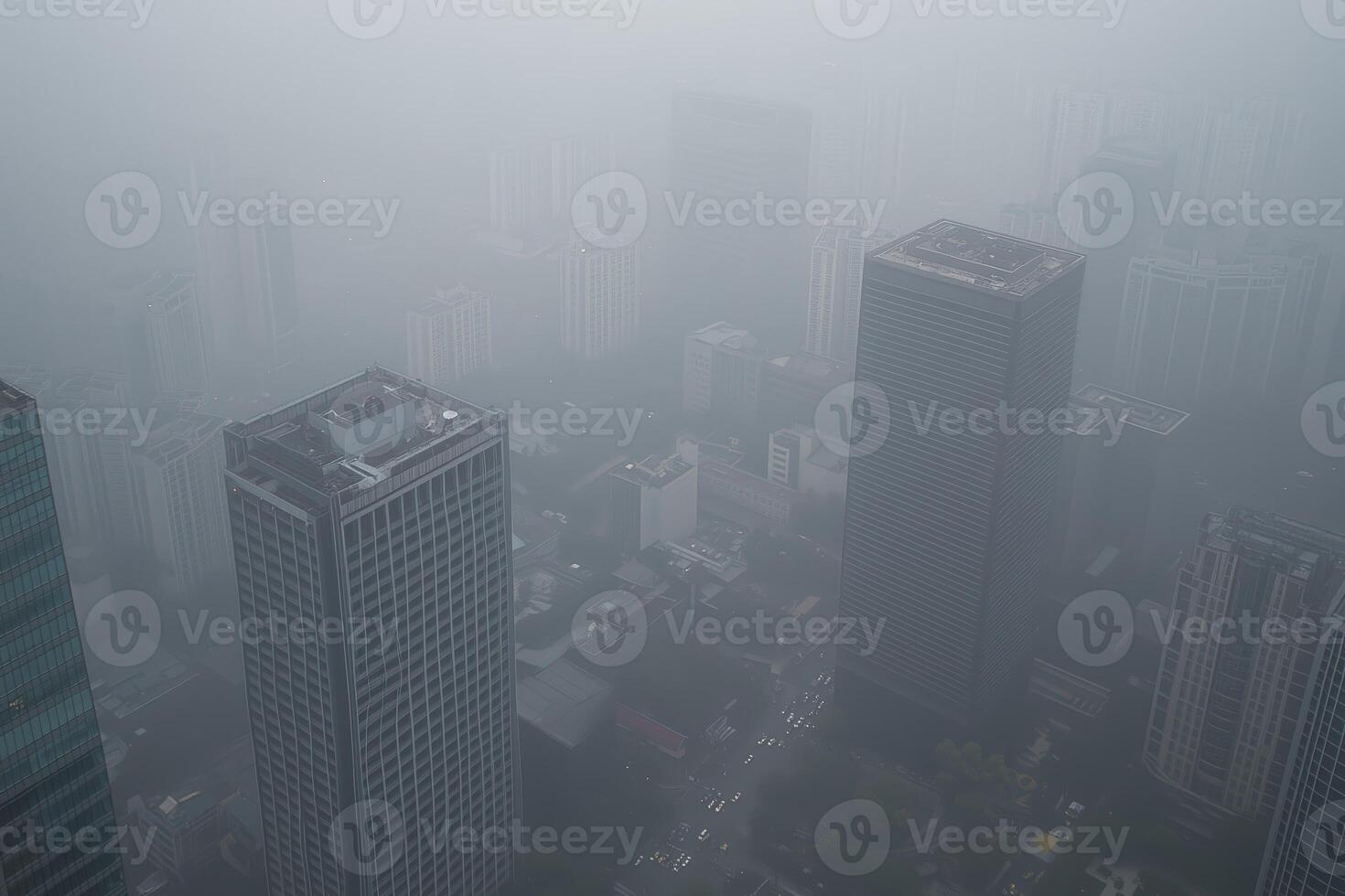 Foggy cityscape over towering skyscrapers in dense mist and fog photo