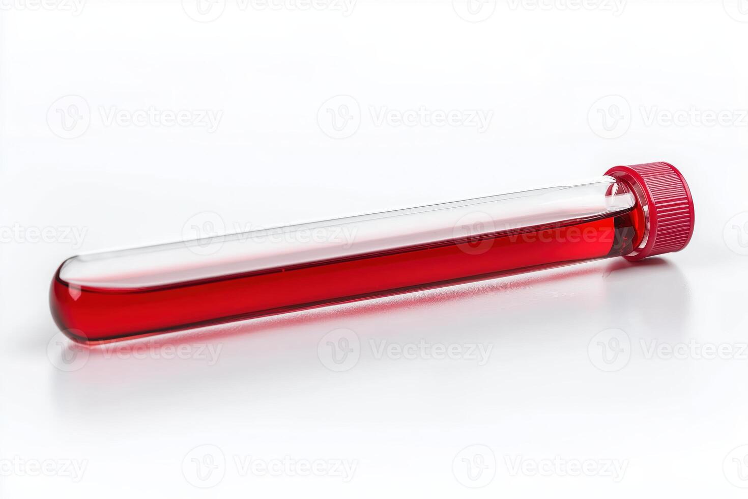 Close-up of a laboratory test tube filled with red liquid photo
