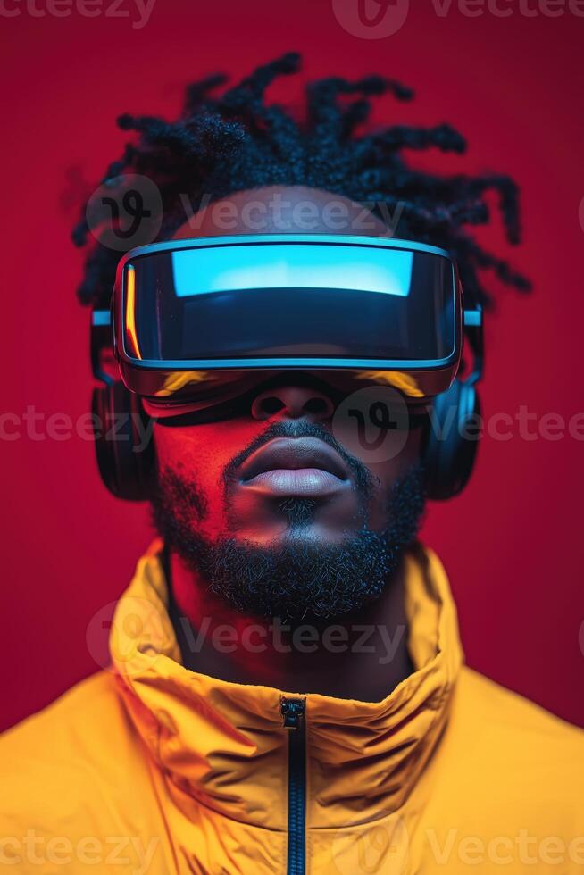 Man wearing virtual reality headset with vivid red background and yellow jacket photo