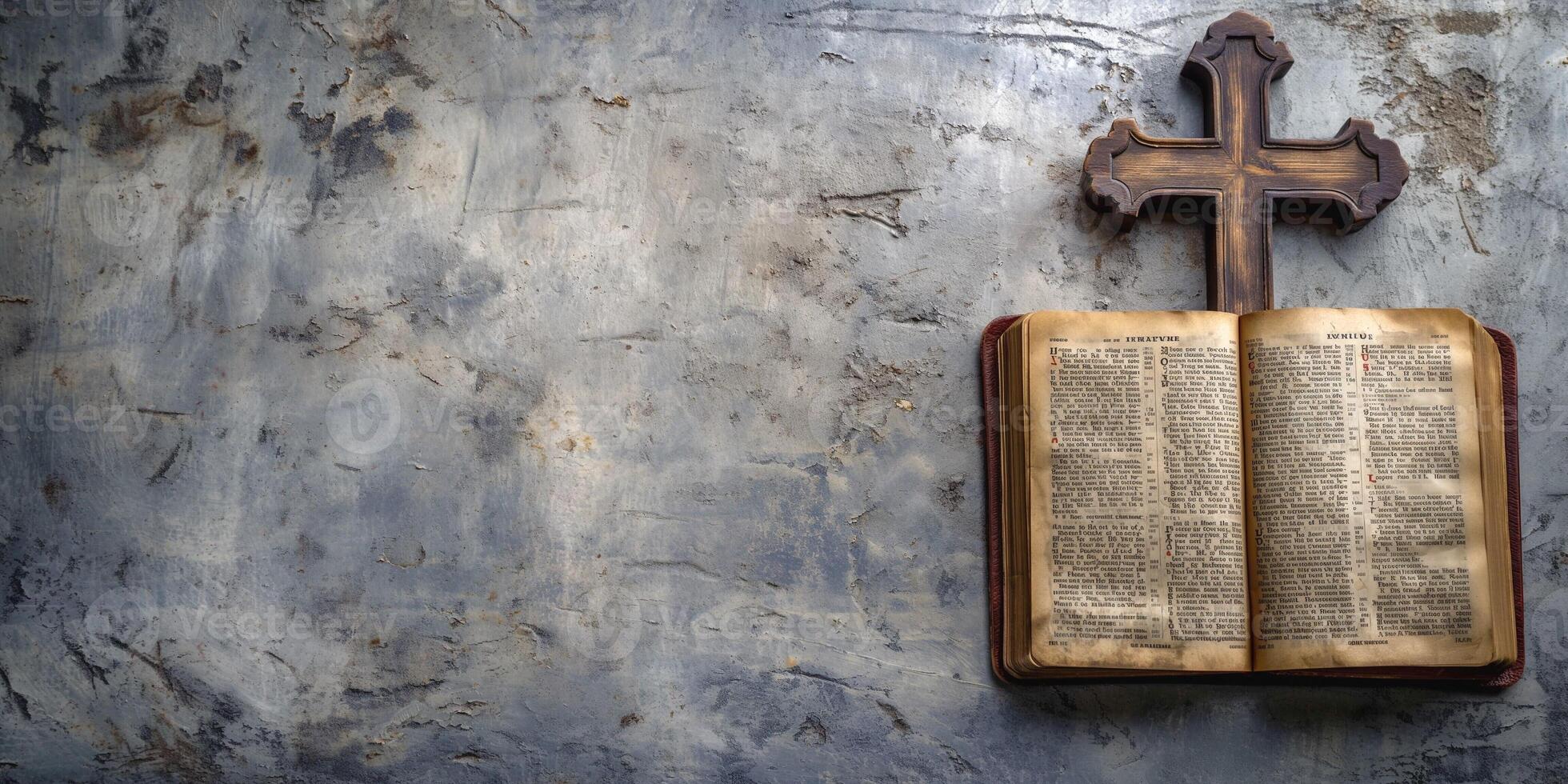 An open antique Bible with a wooden cross on a weathered, textured background, reflecting themes of faith and spirituality. photo
