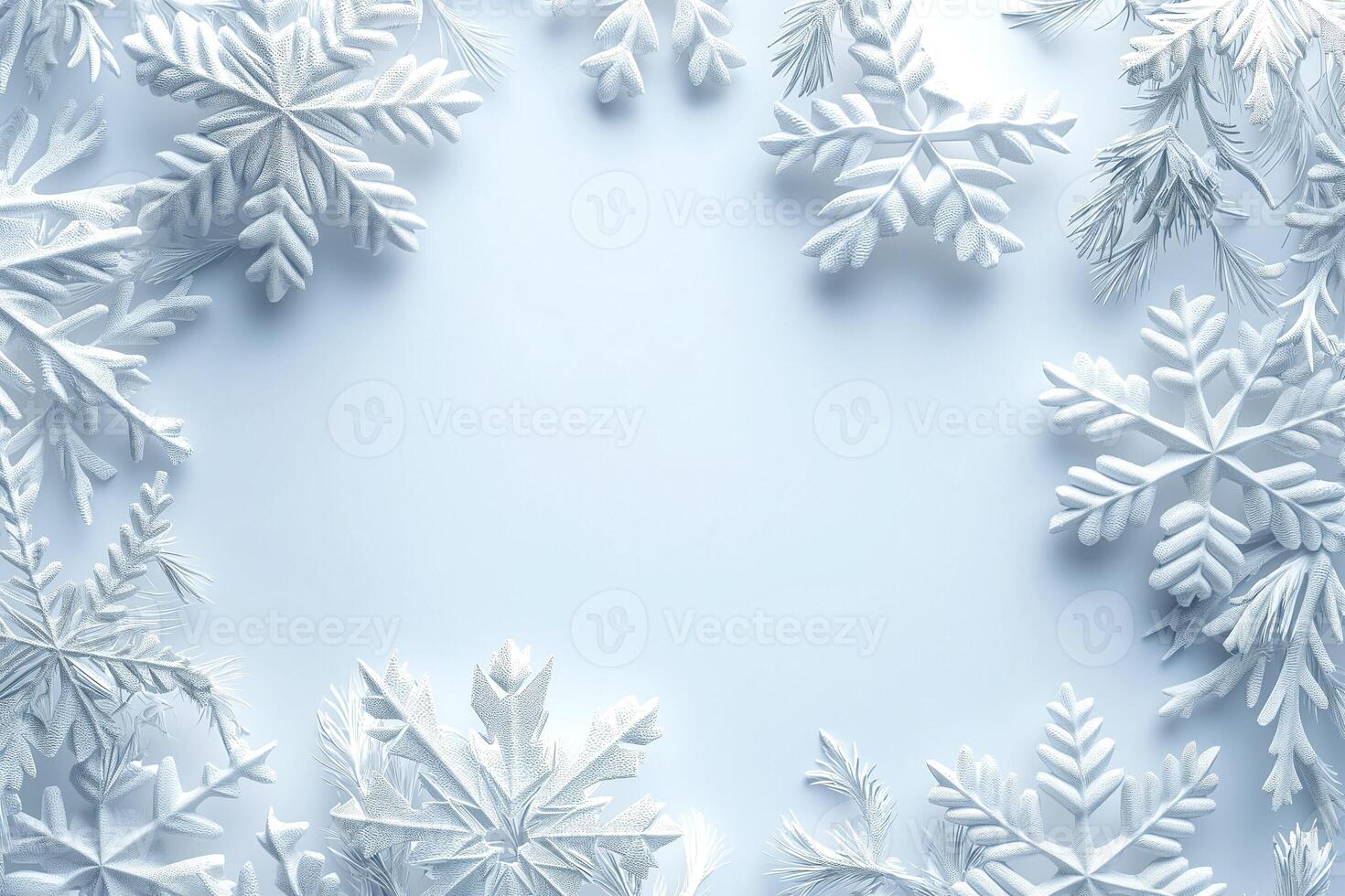 Delicate white snowflakes and frosty leaves create a serene winter frame, perfect for seasonal designs. photo