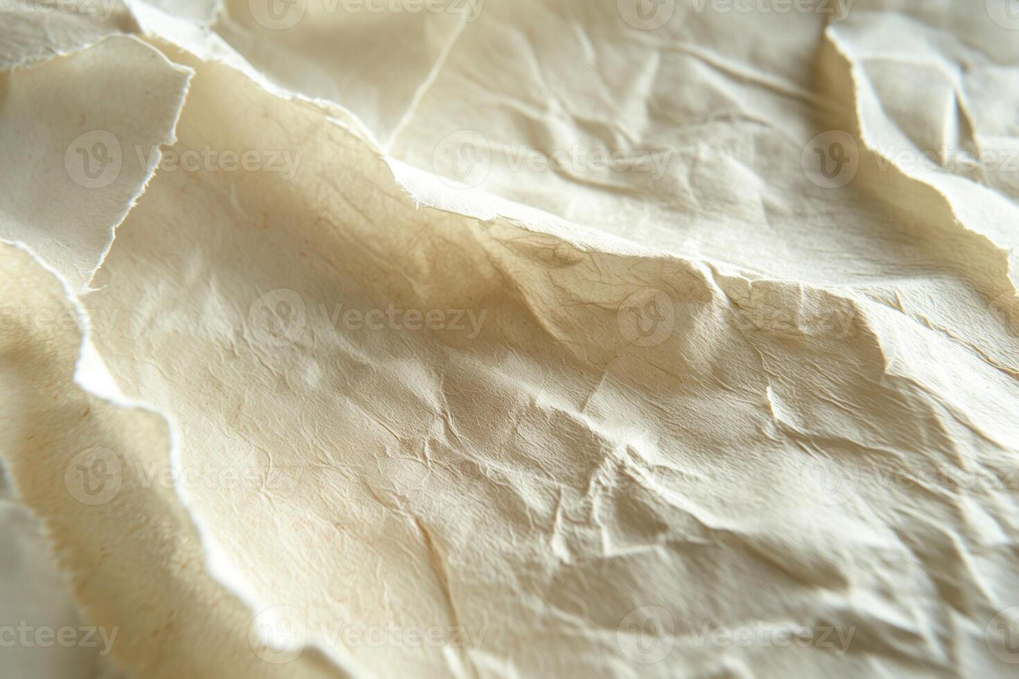 Close-up of textured, crumpled beige fabric showcasing its intricate folds and natural color variations. photo