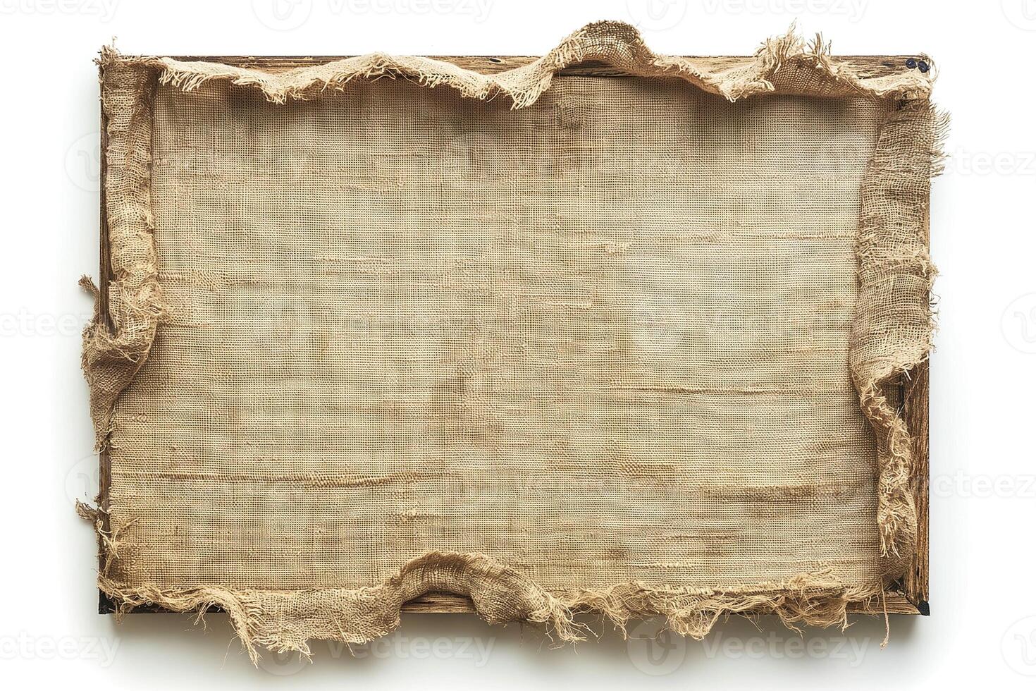 A weathered canvas stretched on a wooden frame, showcasing frayed edges that add character and texture. photo