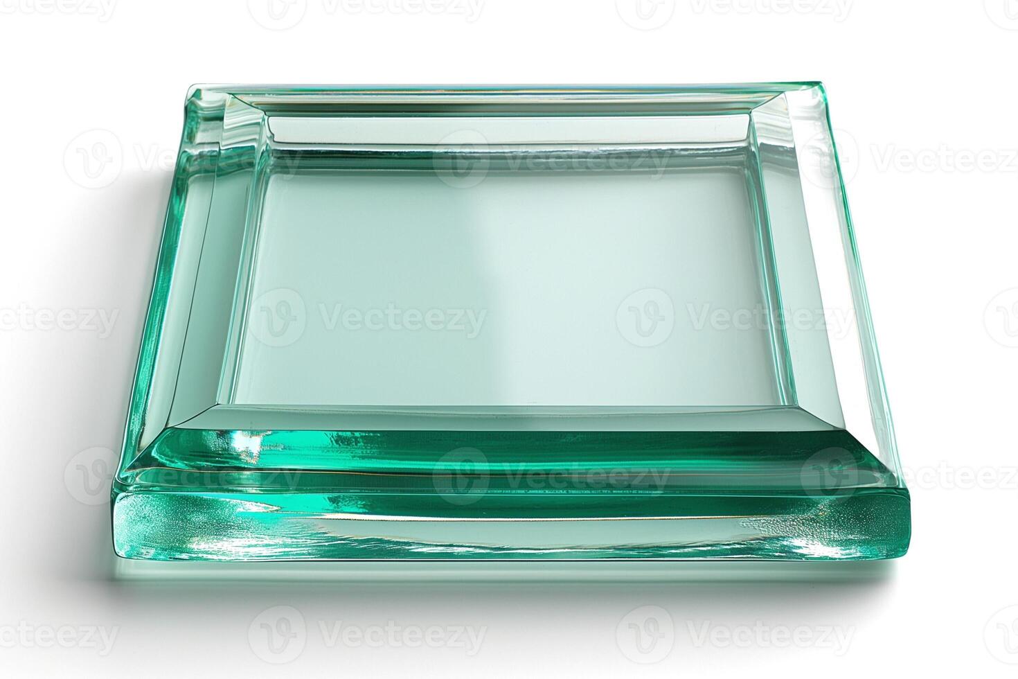 A clear, elegant glass tray with a subtle green tint, showcasing a modern design and polished finish. photo