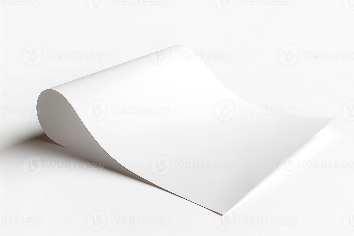 A smooth, blank sheet of white paper elegantly curves over a minimalist background. photo