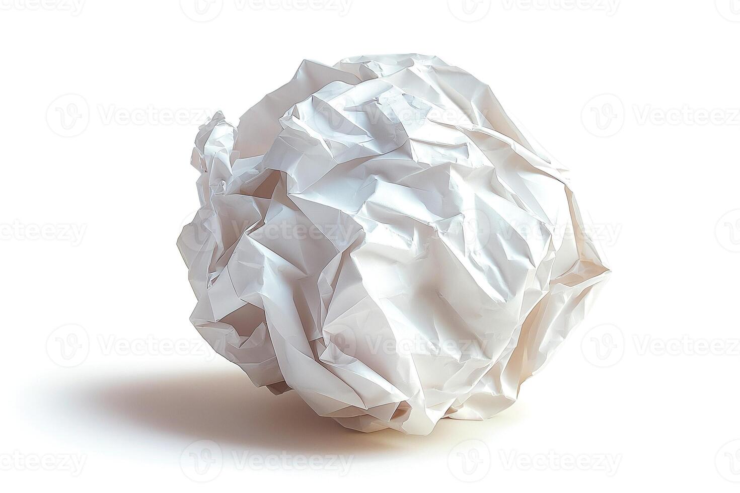 Crumpled white paper ball on a clean surface, symbolizing creativity and discarded ideas. photo