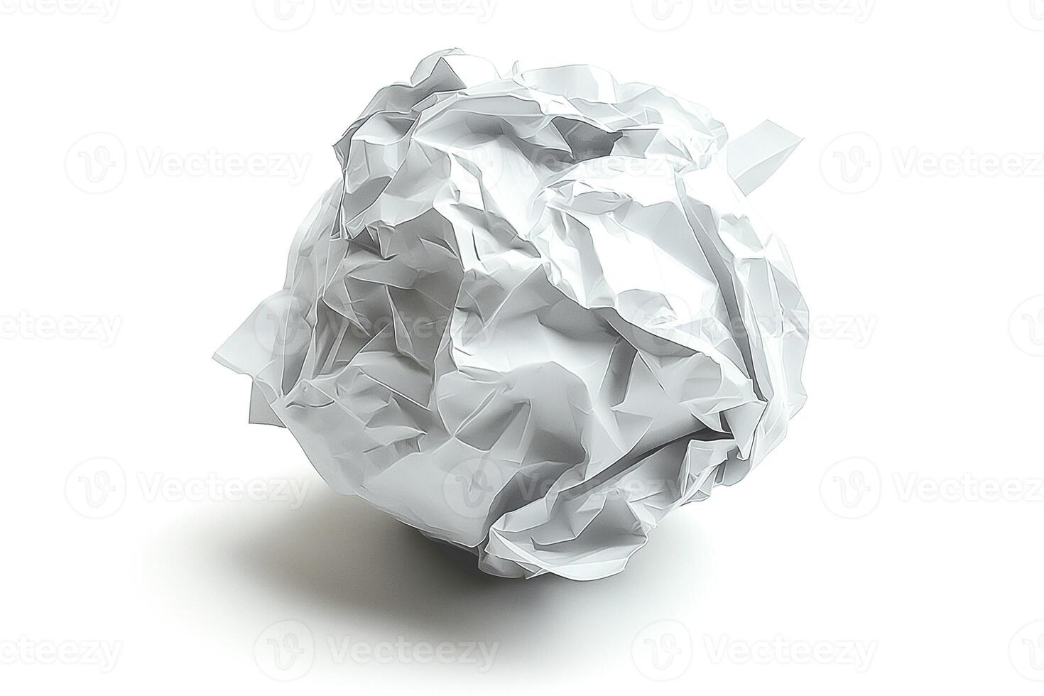 Crumpled white paper ball on a clean surface, representing discarded ideas and creativity. photo