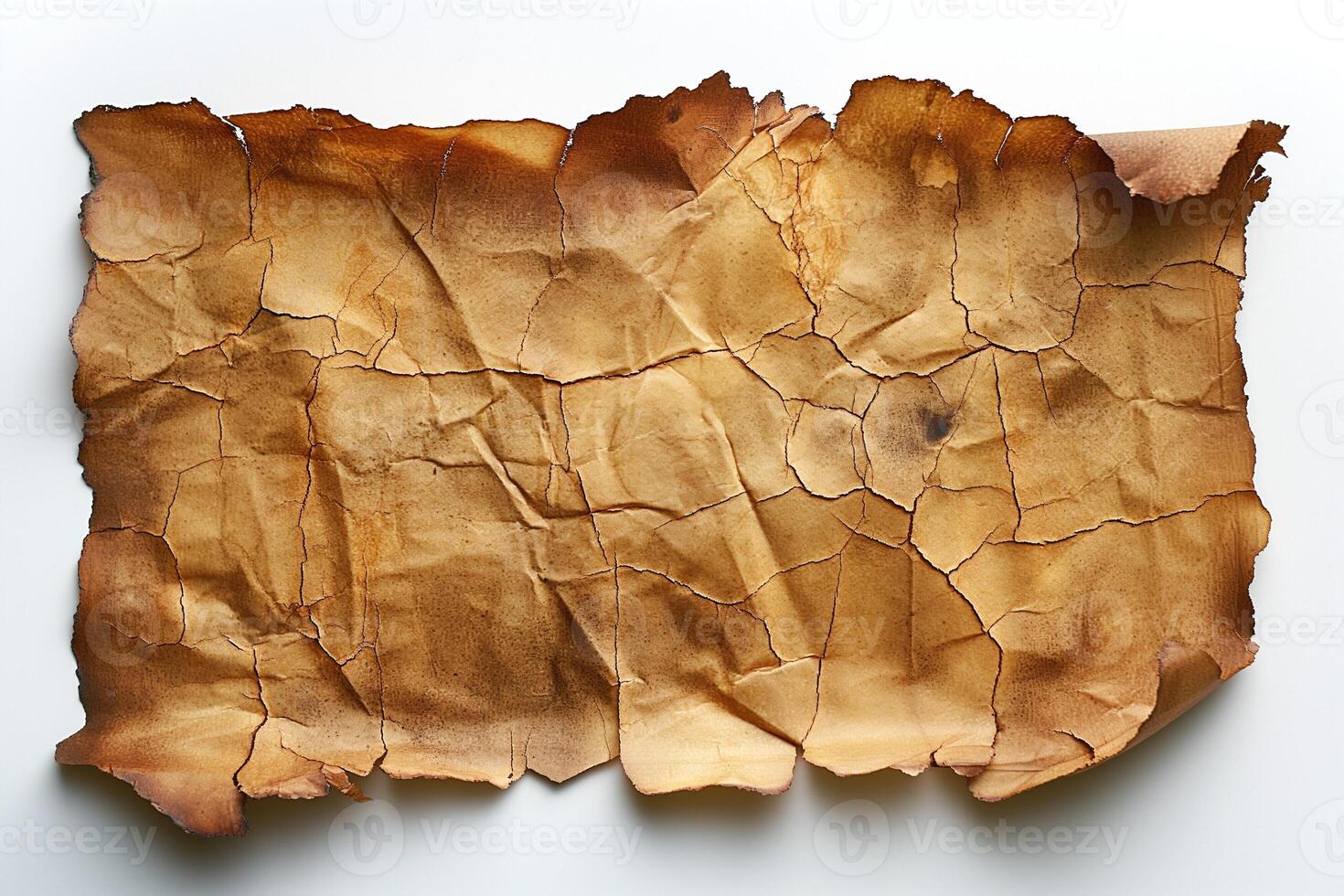 Aged, crumpled parchment paper with cracks and rich brown tones, perfect for historical or artistic themes. photo