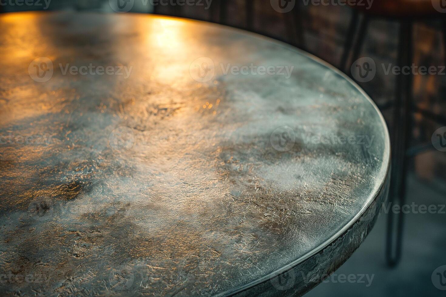 A close-up of a textured metallic tabletop reflecting warm lights, creating an inviting atmosphere. photo