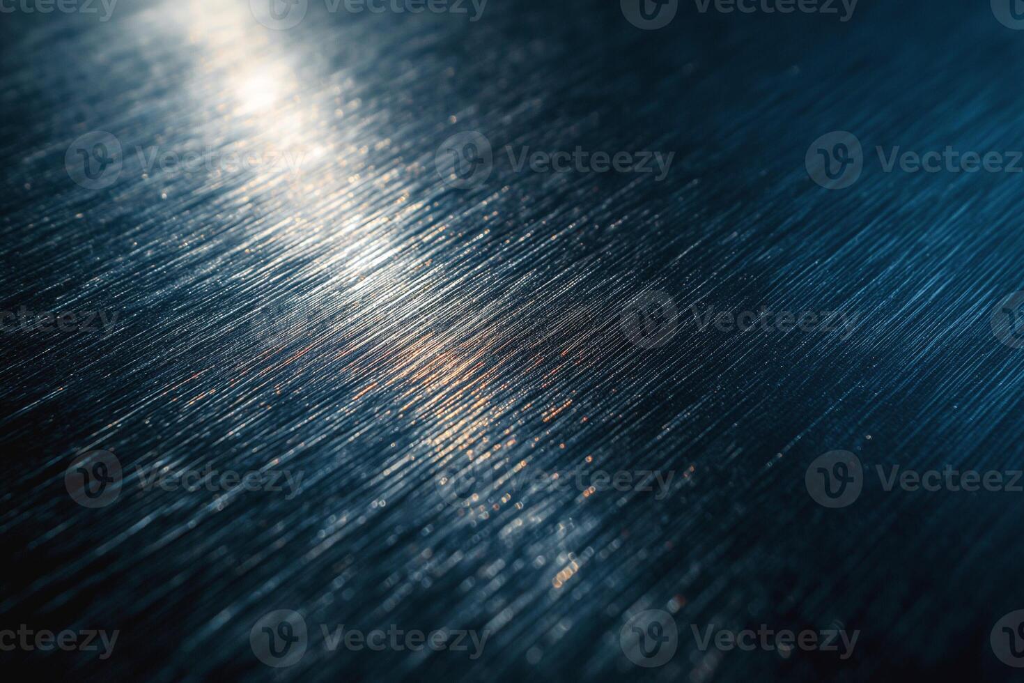 Close-up of brushed metal surface reflecting light, creating an elegant and modern ambiance. photo