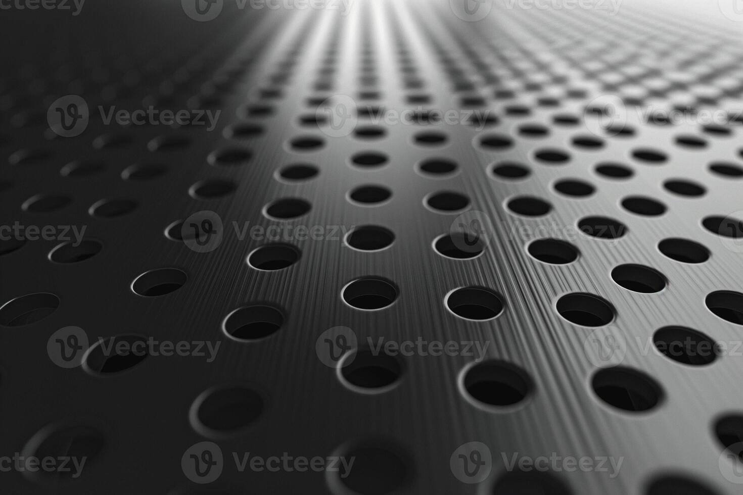 Abstract close-up of a textured metallic surface with circular holes, creating a dynamic visual effect in shades of gray. photo