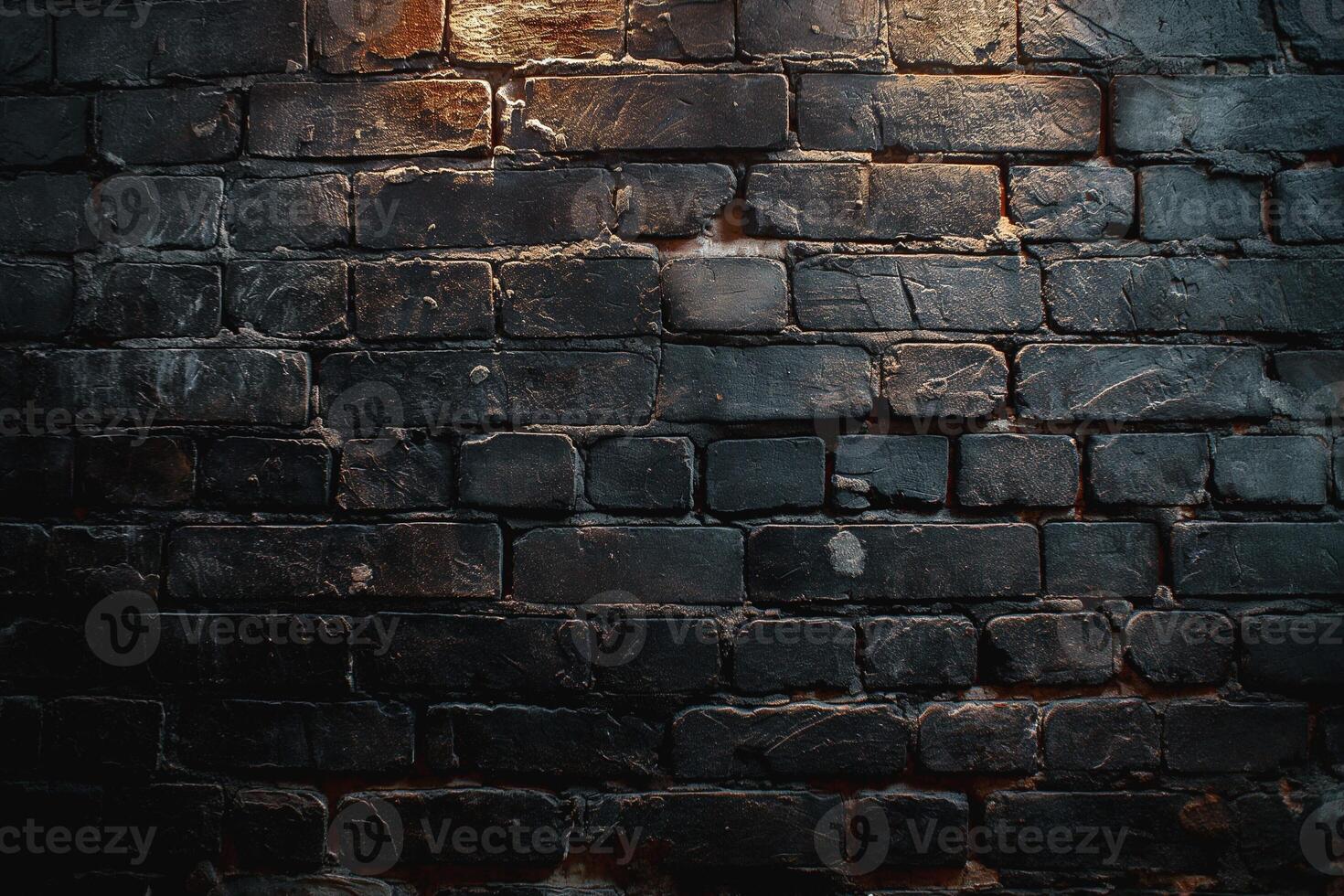Moody close-up of dark, textured brick wall with occasional highlights. photo