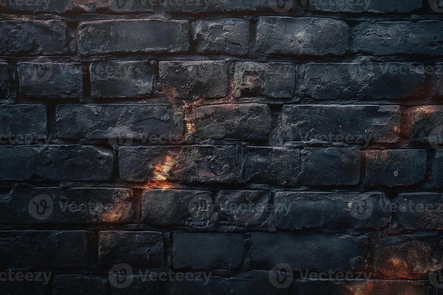 Textured black brick wall with subtle warm highlights, creating an industrial and moody atmosphere. photo