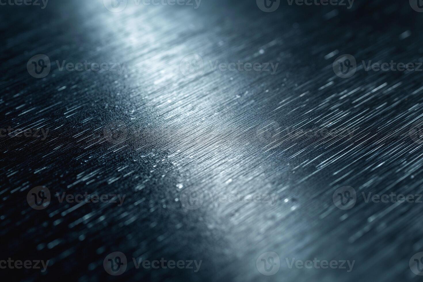 Abstract close-up of textured metallic surface with light reflections highlighting its intricate patterns. photo