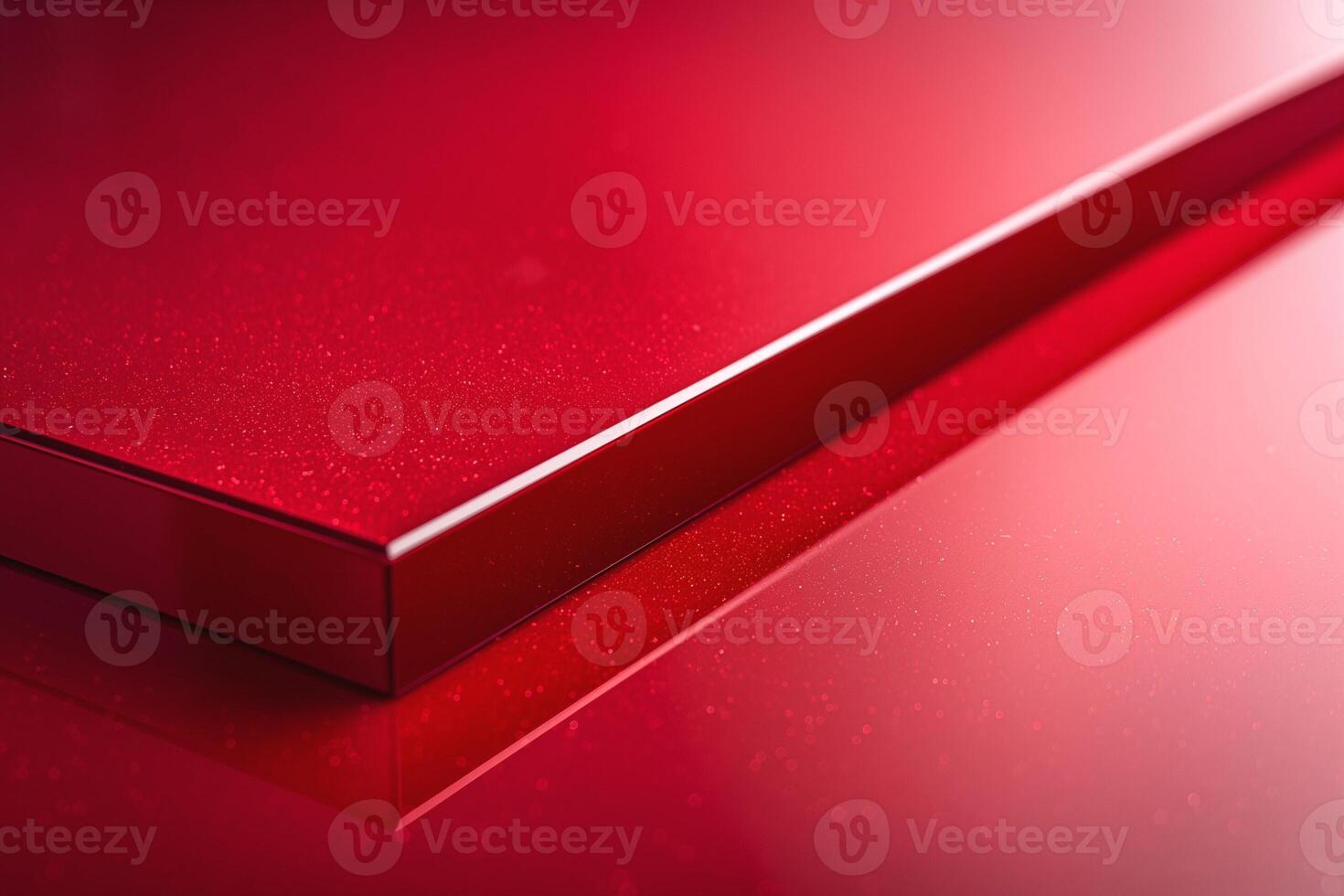 A close-up view of a shiny red surface reflecting light, showcasing its smooth texture and sparkling finish. photo