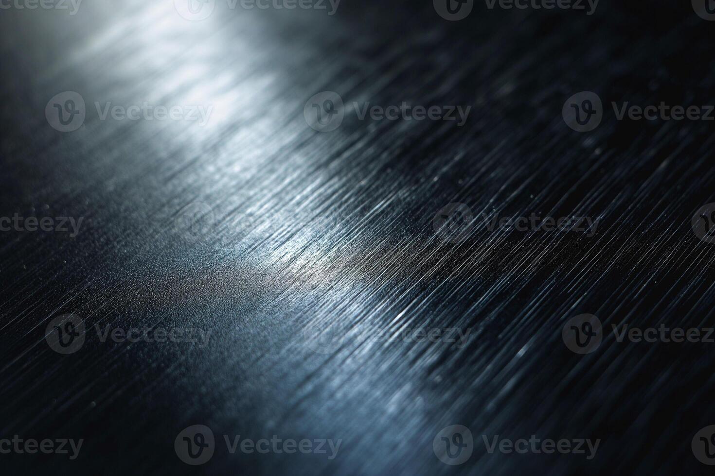 Close-up of textured metal surface reflecting light, showcasing intricate patterns and a dramatic interplay of shadows. photo