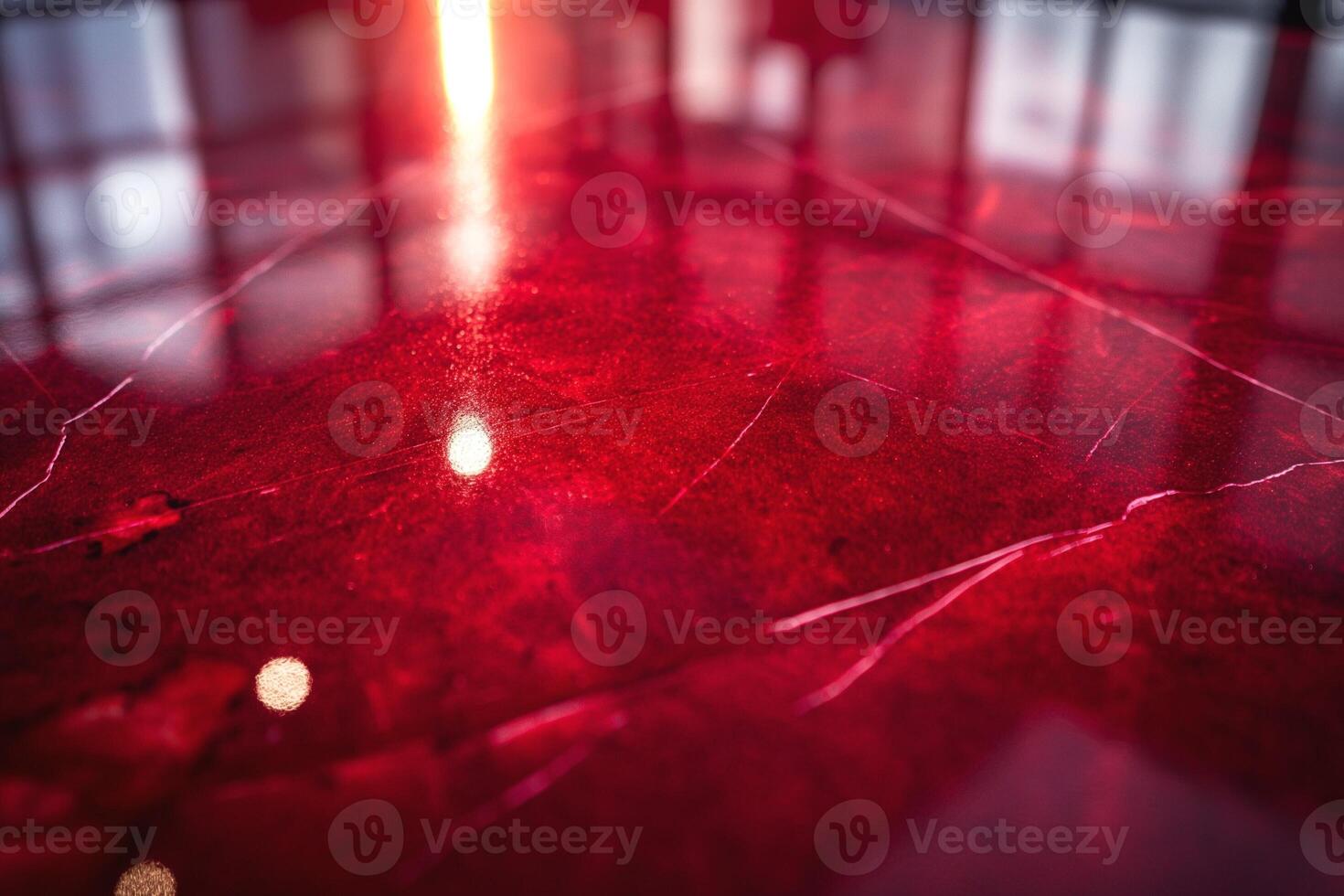 Close-up shot of a polished red marble surface with intricate veining and reflective sheen. photo